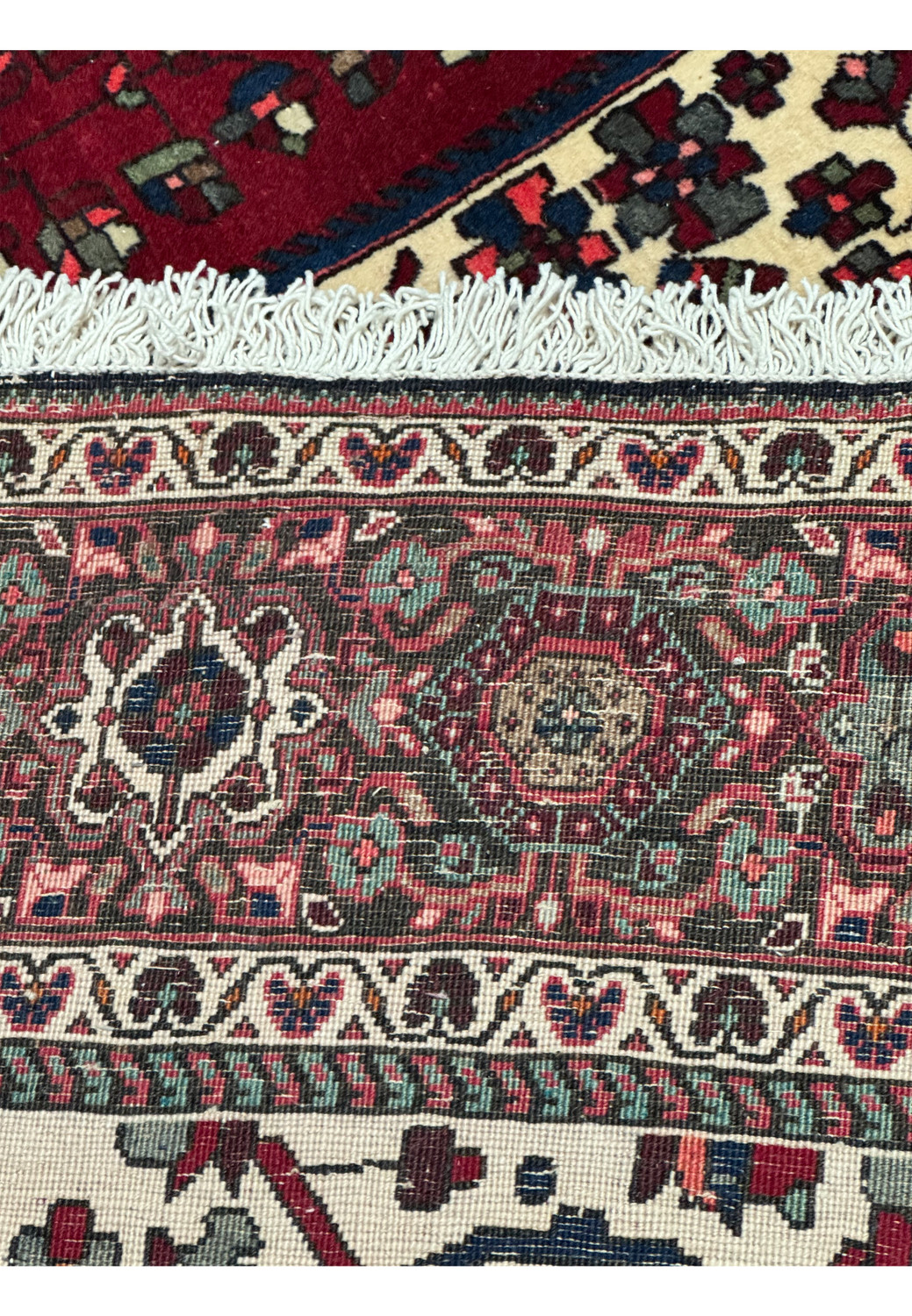 Close-up view of the Persian Qum Kork rug’s surface, with a focus on the intricate design details and the luxurious, soft texture of the Kork wool.