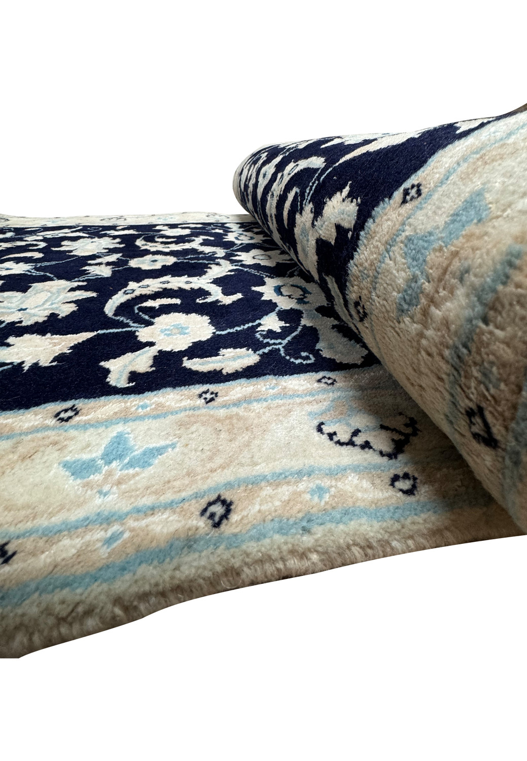 Side view of Persian Nain Runner partially rolled, highlighting the plush pile and pattern continuity on the curved edge.