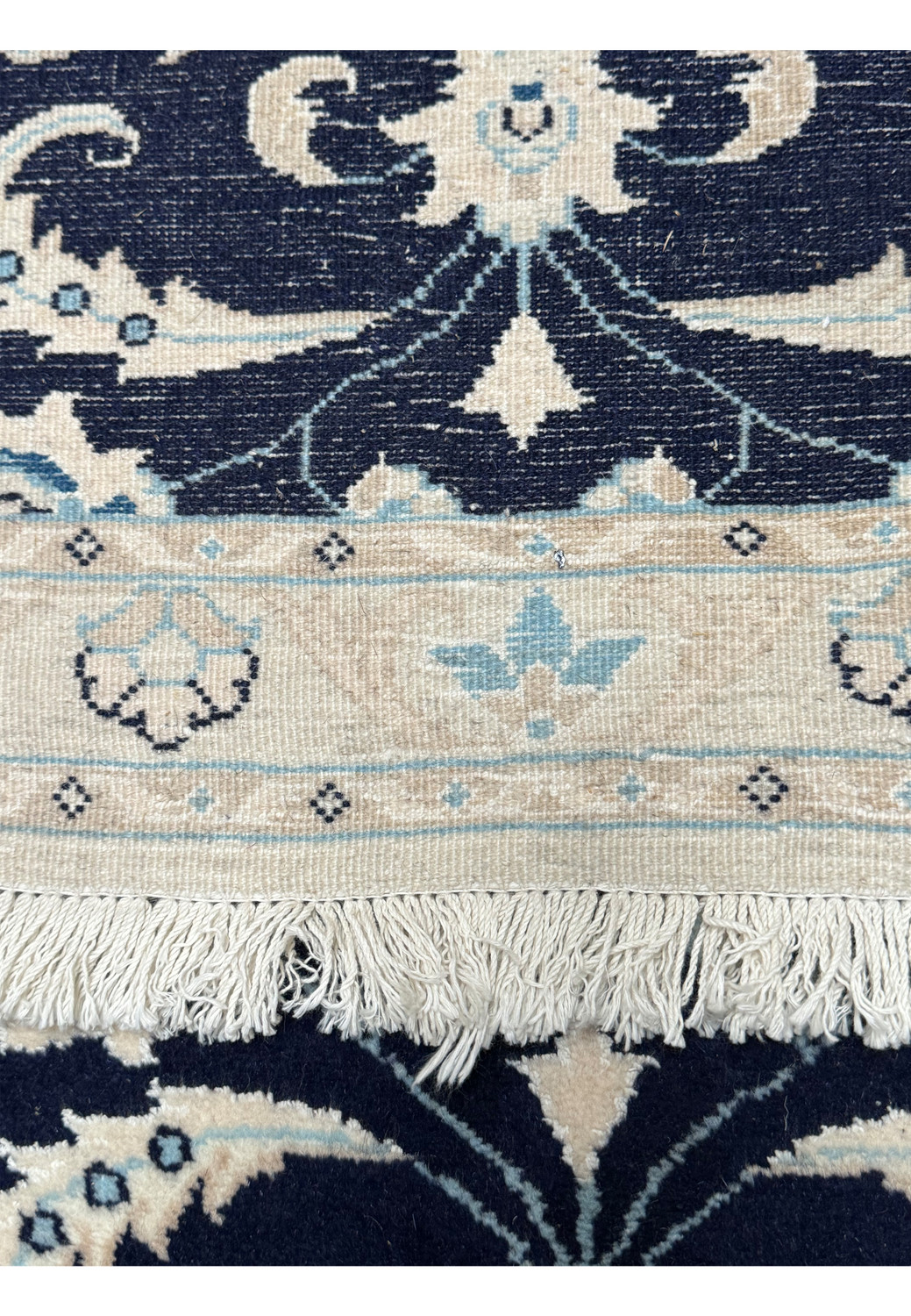 The reverse side of the Persian Nain Runner showing the woven structure and knots, indicative of its handcrafted quality and authenticity.