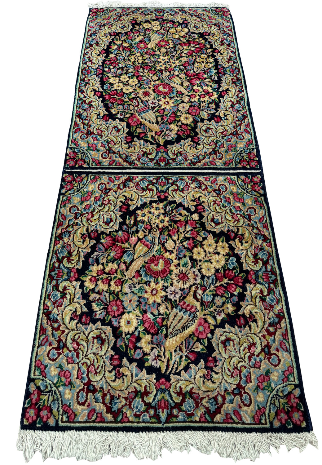 Top view of the Persian Kerman rug's elaborate floral design and dual-rug weaving technique."