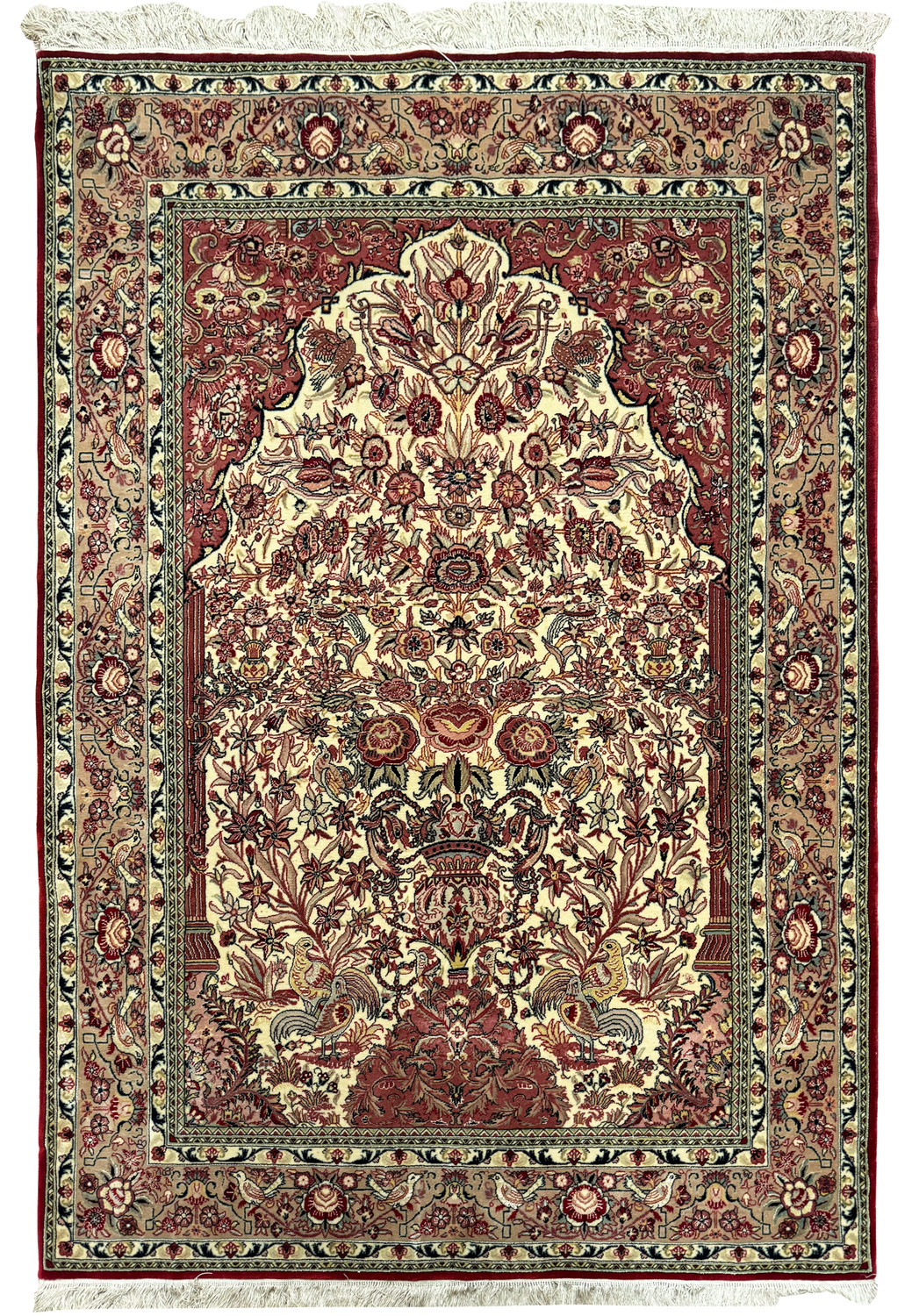 Full view of a 4'4" x 7' Persian Qum rug laid out flat, showcasing the intricate floral medallion design in the center with a detailed border, in a color palette of red, blue, cream, and silk accents.