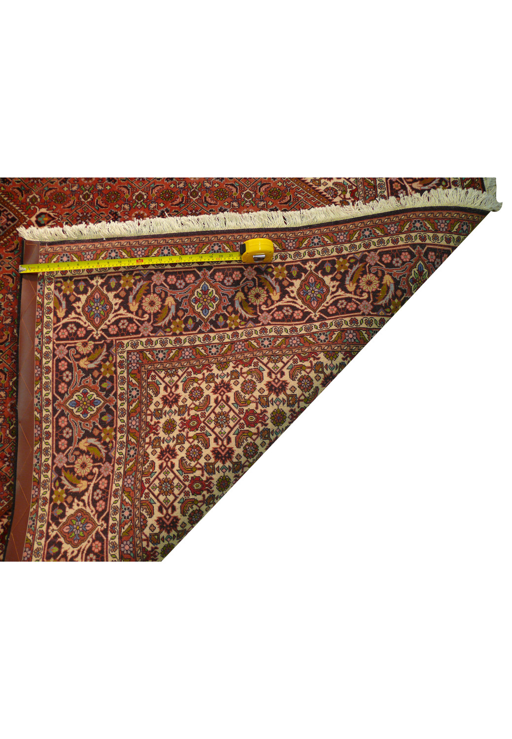 The backside of the Persian Bijar Iron Rug, showing the fine craftsmanship with the patterns faintly visible, indicative of the rug's dense knotting and quality weave.