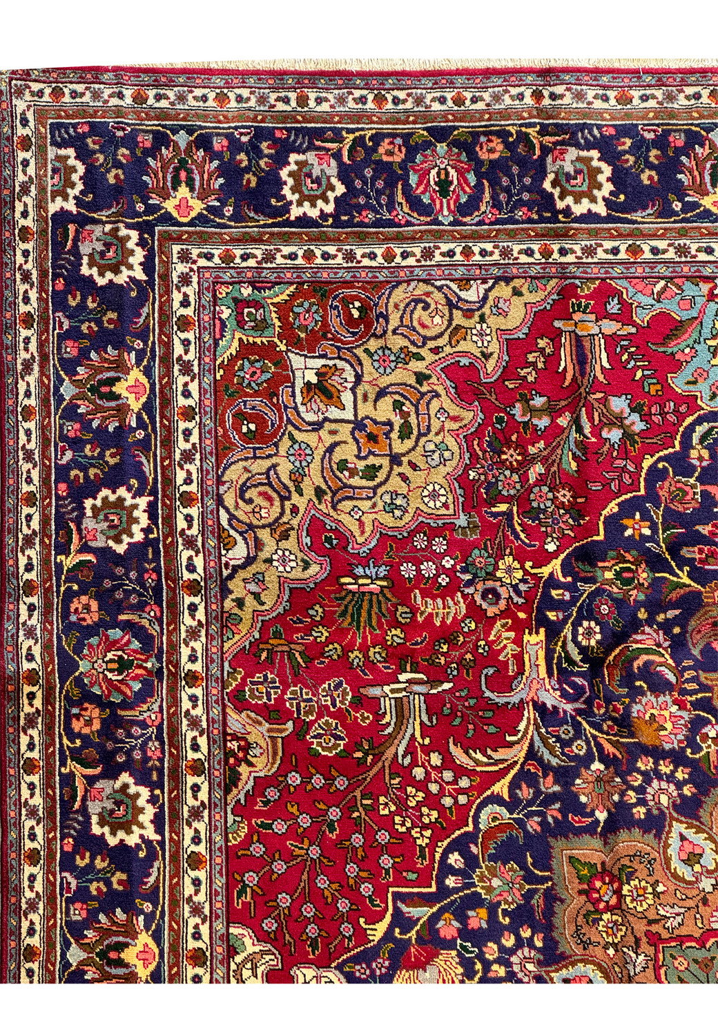 Corner section of the Persian Geometric Tabriz Rug displaying the intersection of the main field's floral design with the ornate border patterns