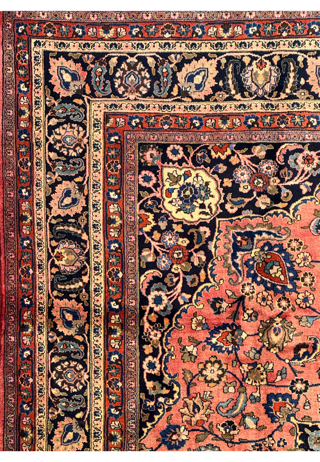 Corner section of the Persian Mashad rug illustrating the border design and fringe detail