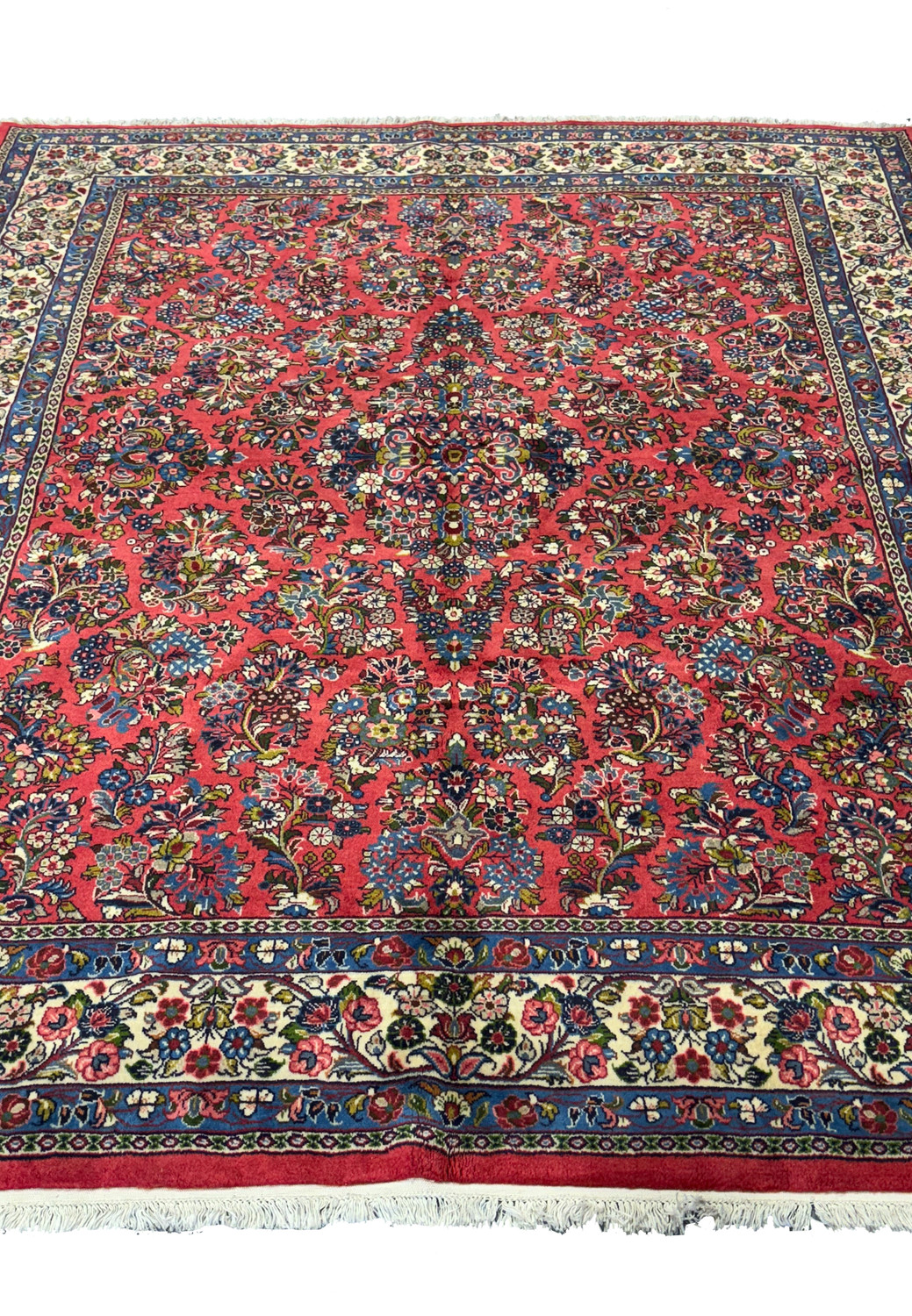 Floral design of an 8'1 x 8'9" Persian Sarough Rug showcasing vibrant red and navy blue with intricate details.