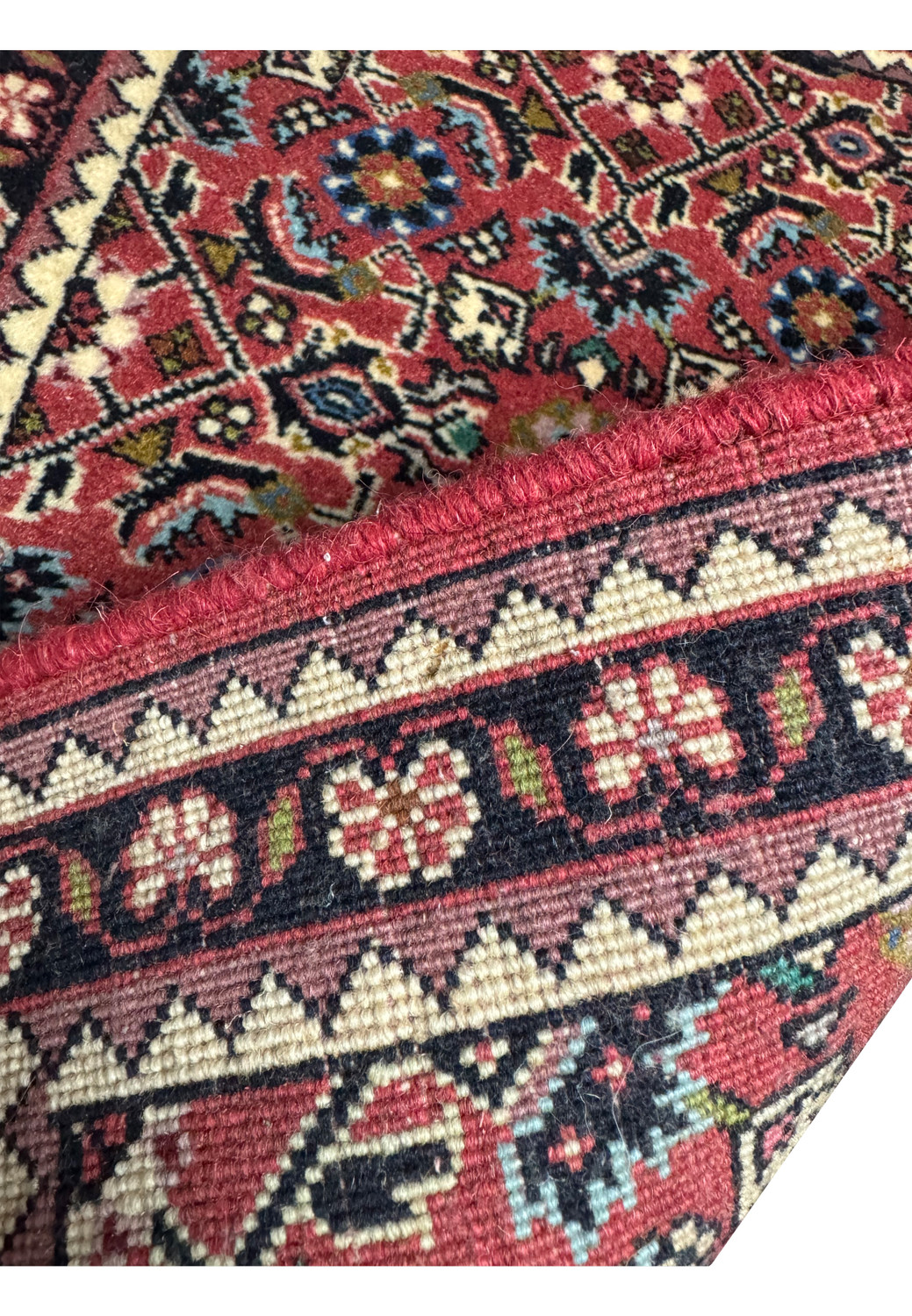 Backside of Persian Bijar Poshti Rug showing tight hand-knotted construction.