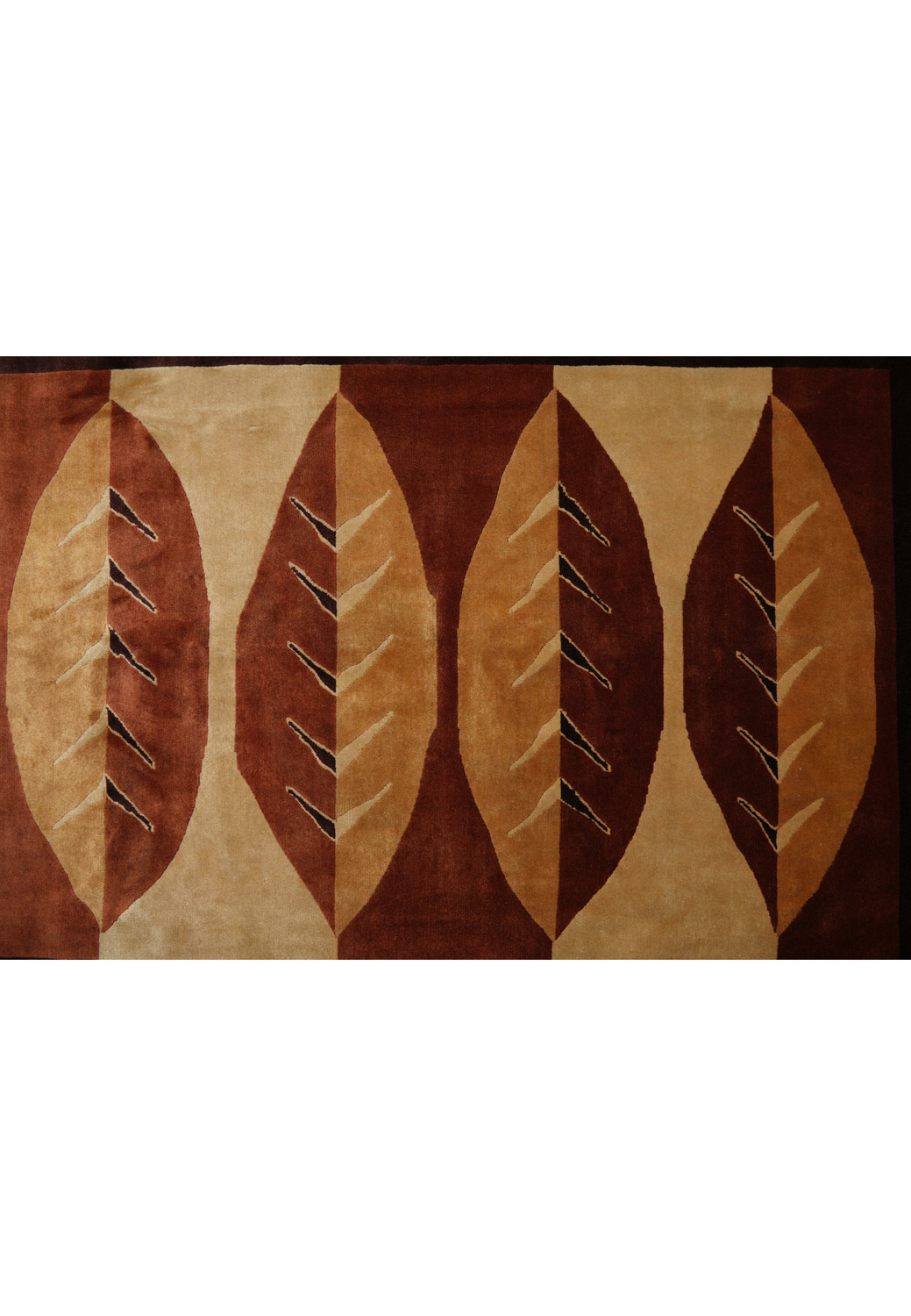 Close-up of leaf motif in beige and burnt orange tones