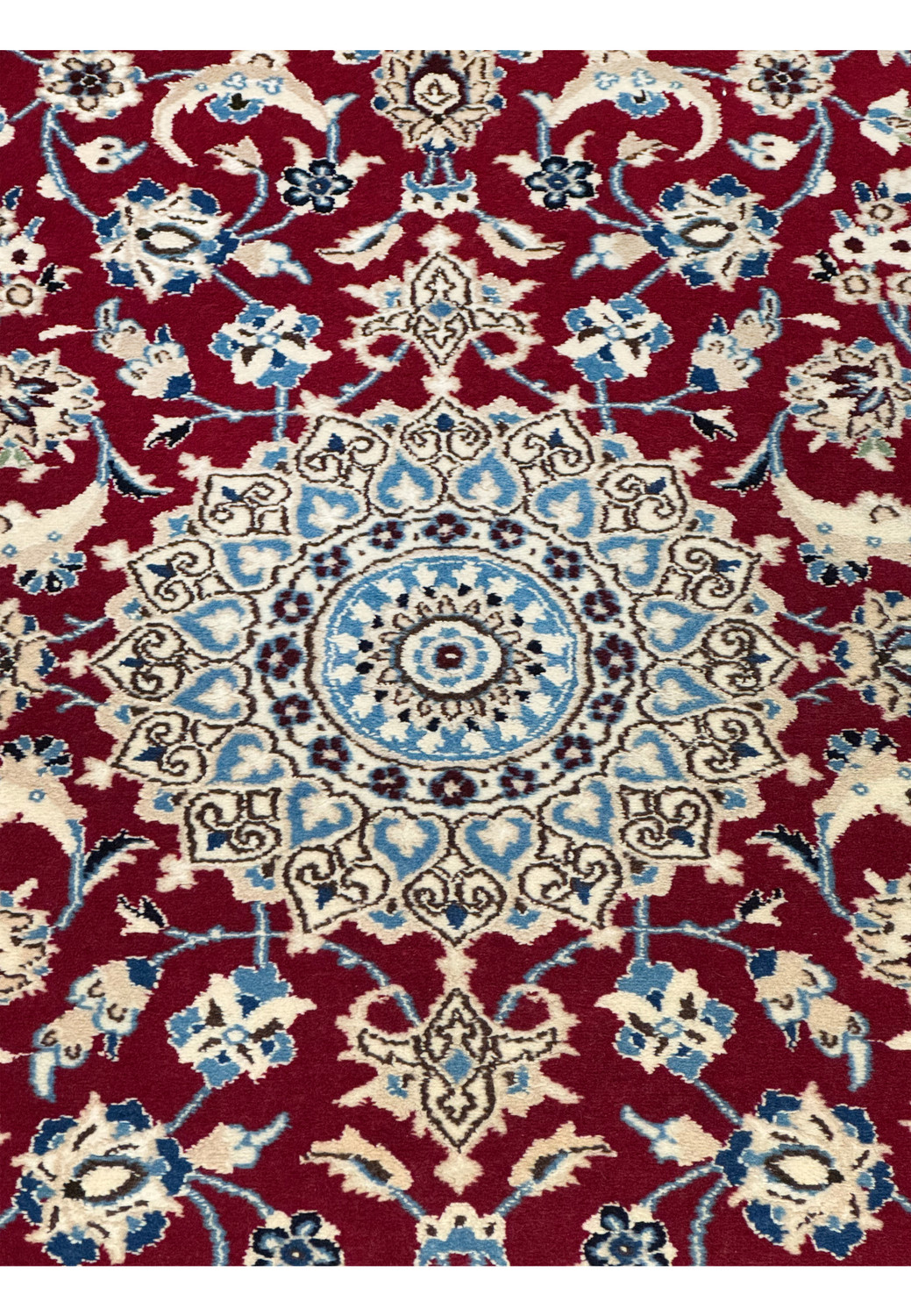 Medallion design in blue and ivory on Persian Nain wool and silk rug