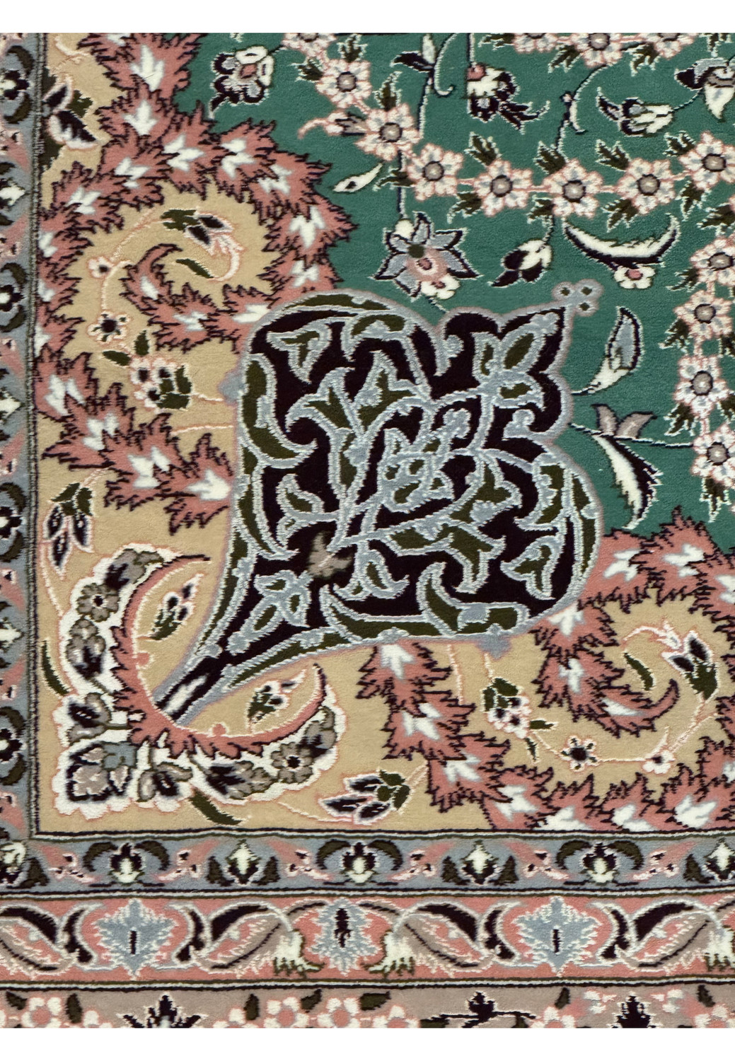 Close-up of intricate floral border design on Persian Isfahan rug