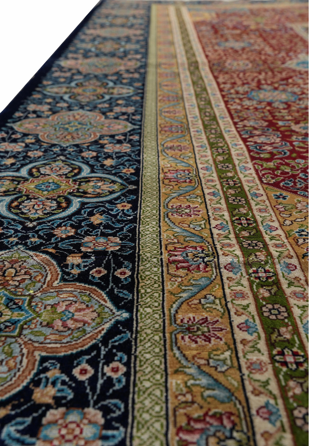 Ornate floral border detail of 6x9 vintage oriental silk rug, signed Kurosh."