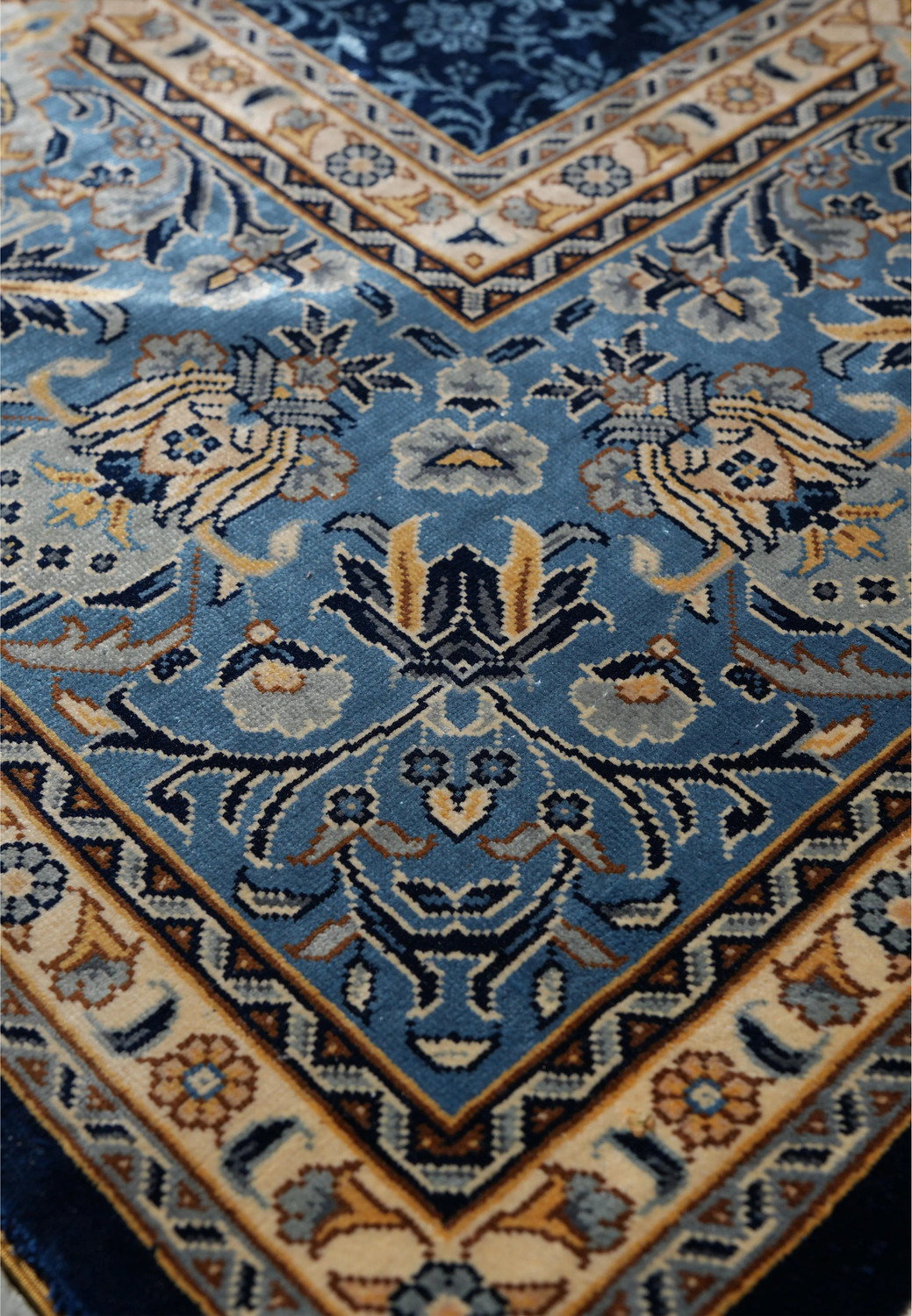 Ornate floral border of vintage 6x9 oriental silk rug, hand-knotted and signed.