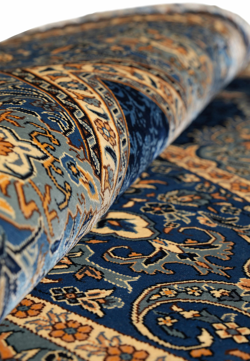 Rolled 6x9 oriental silk rug, navy and ivory silk with starburst medallion.