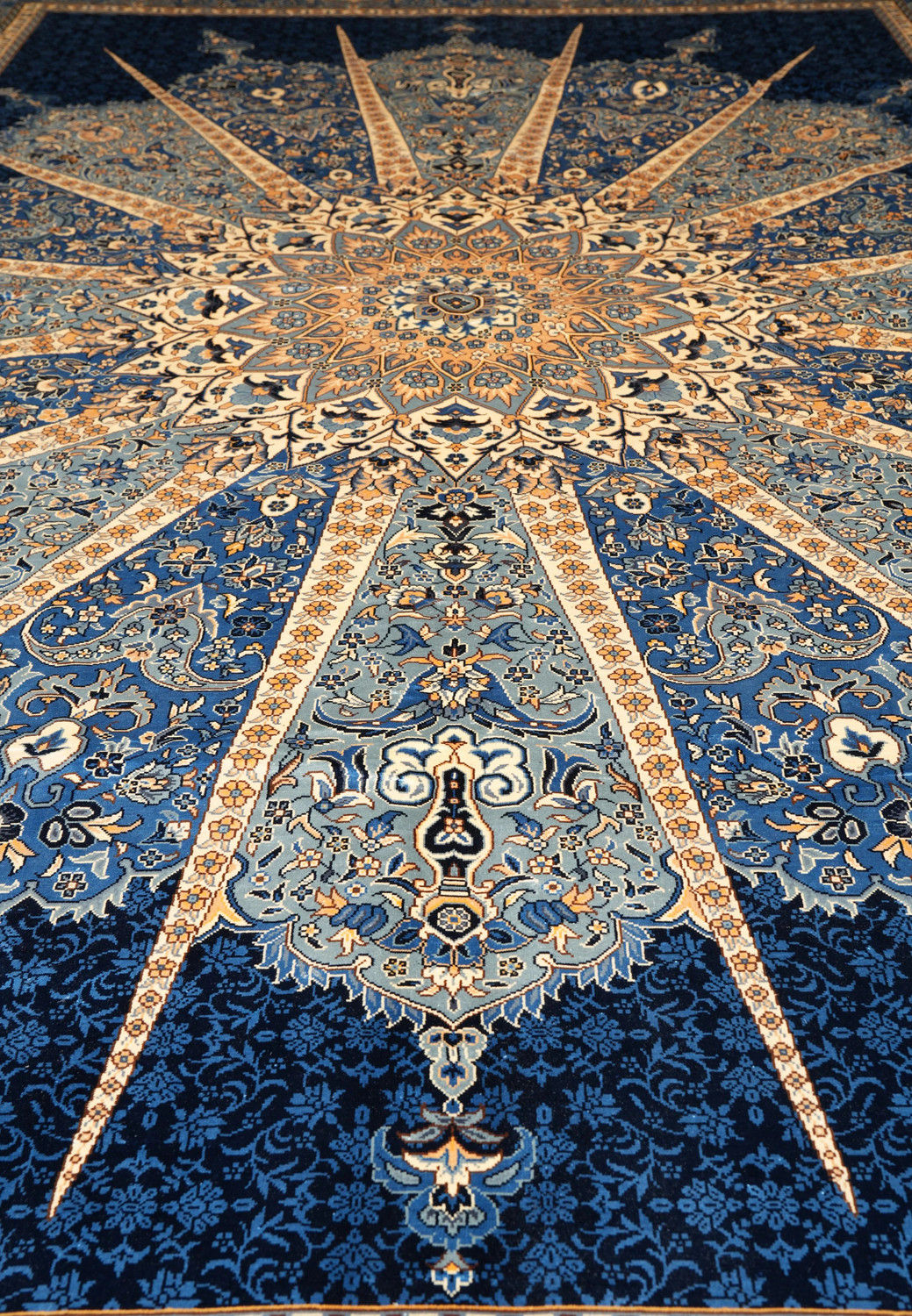 Floral motifs and radiant silk medallion detail on 6x9 signed oriental rug.