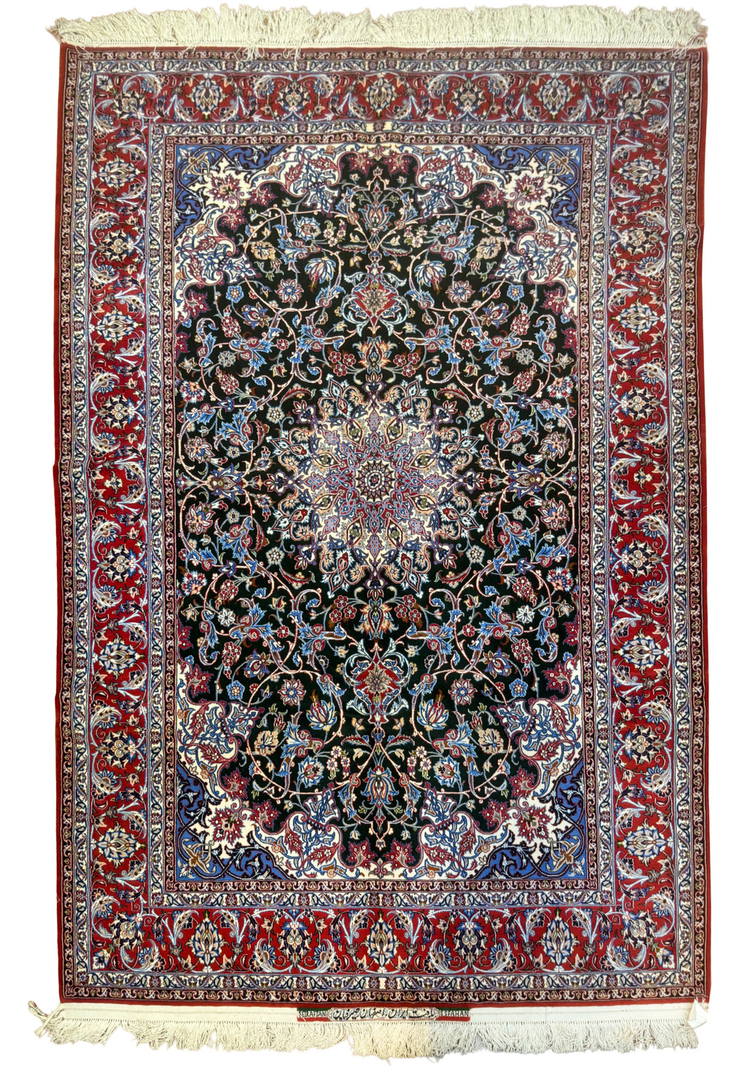 5x8 Signed Persian Isfahan Seirafian wool and silk rug with hunter green field, floral medallion, and crimson red borders.