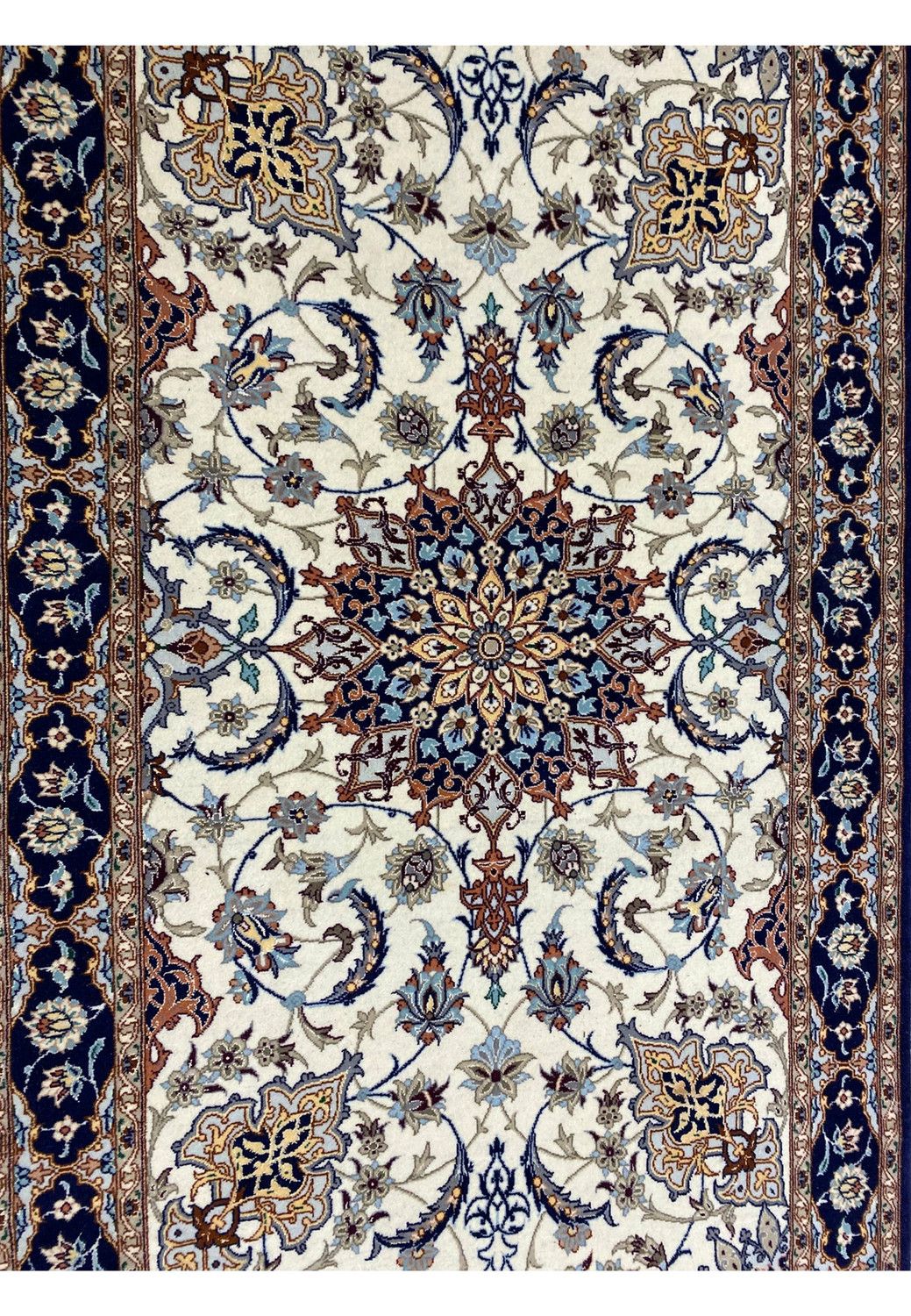 Detailed view of ivory field with scrolling vines and blue, rust, and taupe floral motifs on Persian Isfahan runner. Detailed view of ivory field with scrolling vines and blue, rust, and taupe floral motifs on Persian Isfahan runner.