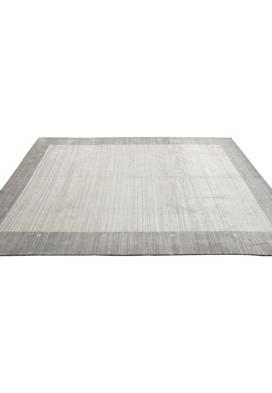 9.2 x 12.1 plain gray handmade wool rug laid flat showing minimalist design