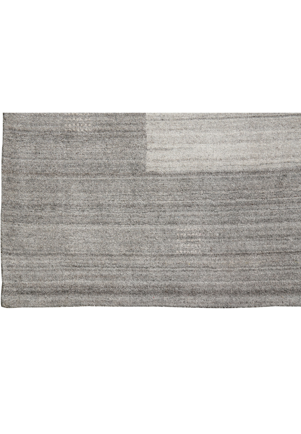 Close up of border on 9.2 x 12.1 gray wool handmade rug showing tonal gray transition