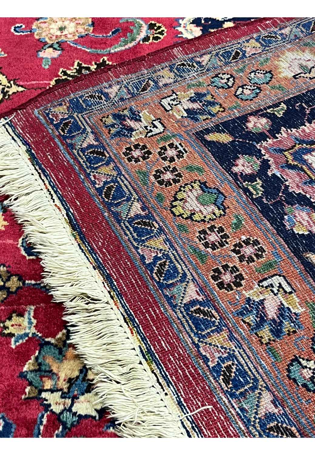 Backside of 9'8 x 9'9 Square Persian Mashad Rug showing fine hand-knotted wool weave and fringe