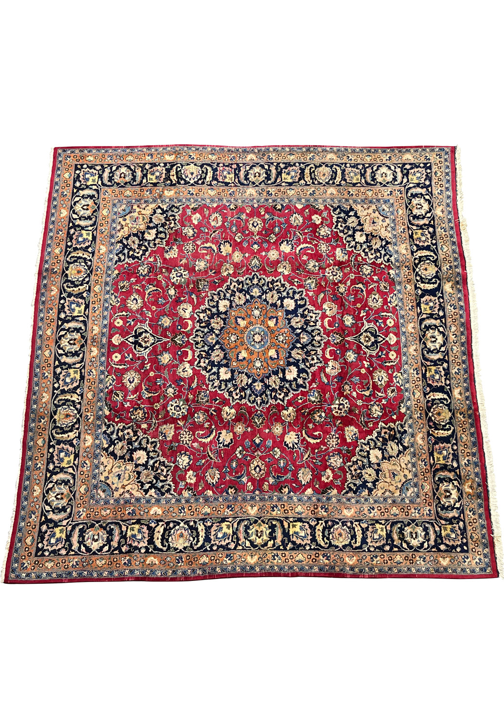 Angled view of Persian Mashad Rug showing rare square shape and bold floral design