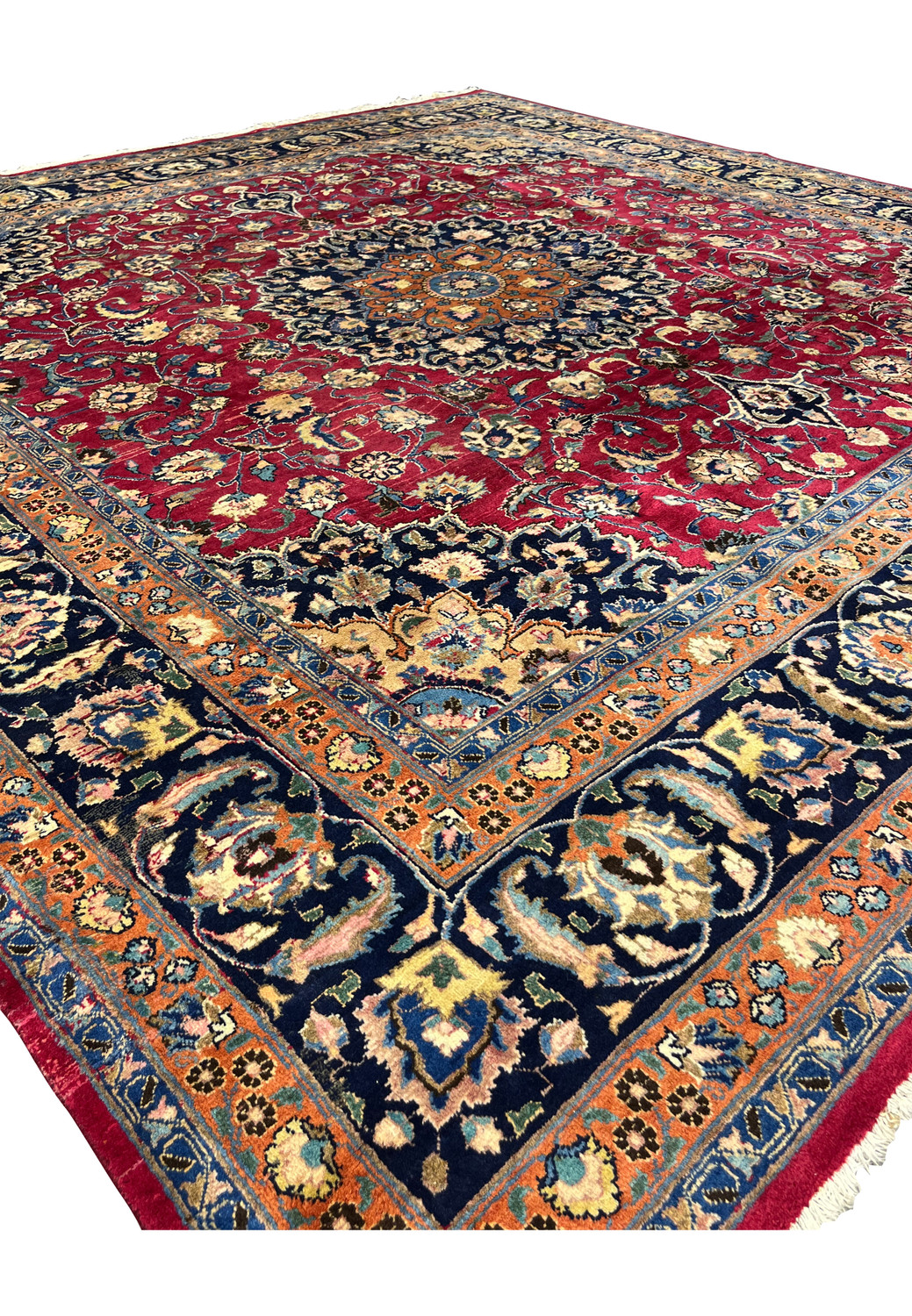 Angled perspective of red field with central medallion and intricate motifs