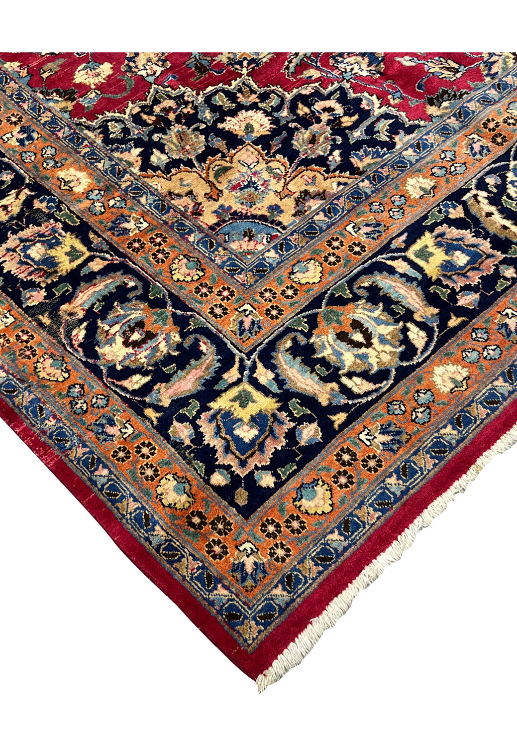 Corner detail of Mashad Rug with navy floral border and orange guard band