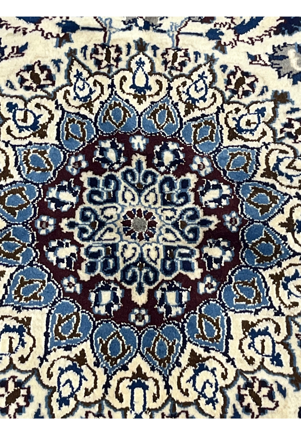 Close-up of the medallion on Square Persian Nain Rug with ivory, blue, and burgundy detailing