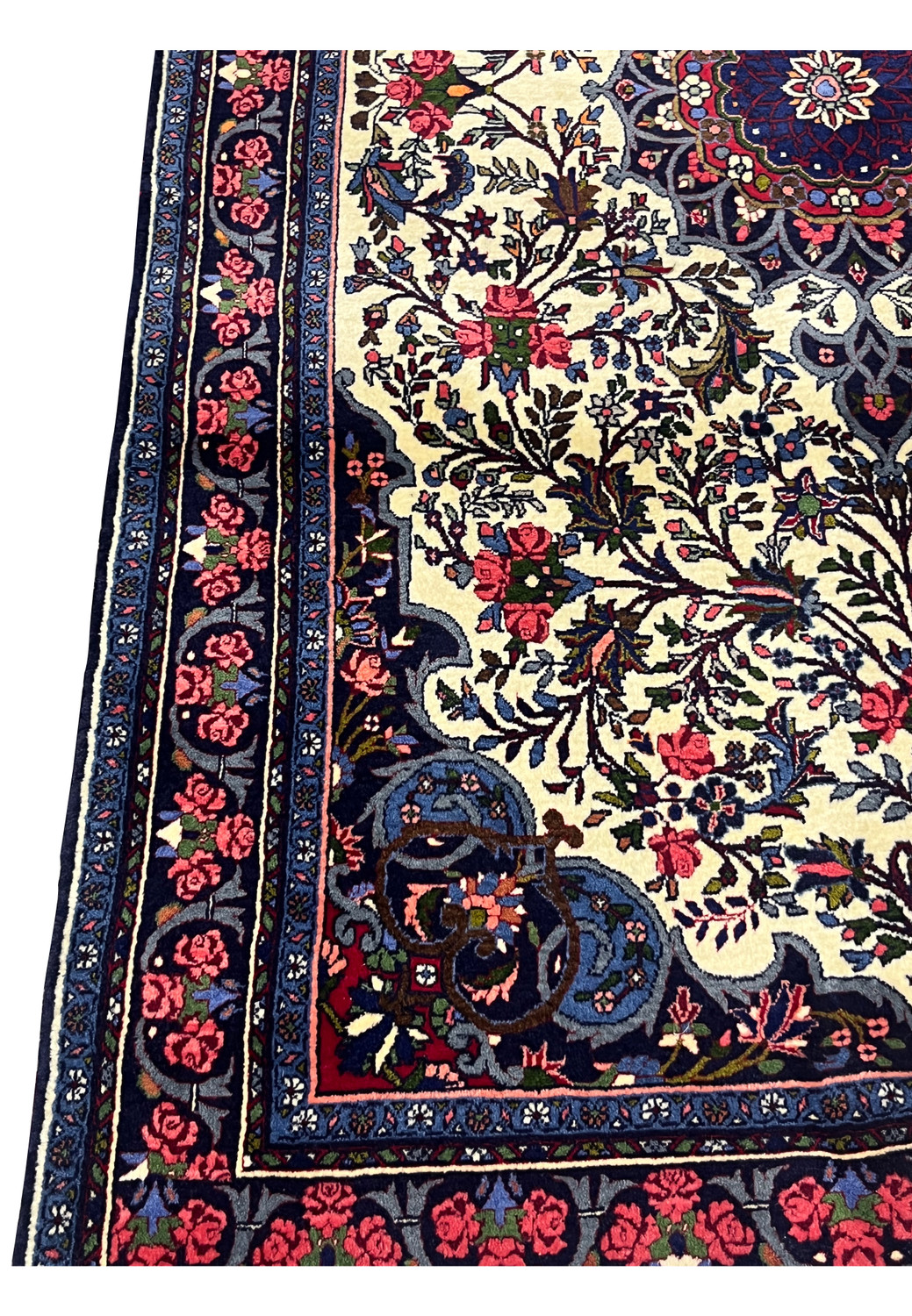 Border detail of Persian Bijar Rug with continuous rose motif on navy blue