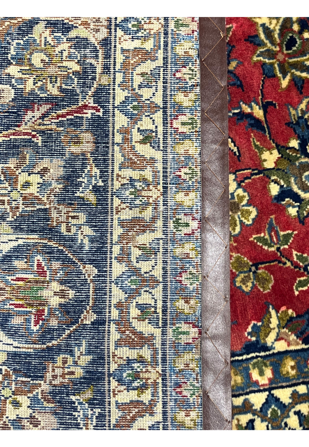 Alternate backside close-up of the 8'7 x 12'7 Distressed Persian Isfahan Rug, showing tight knots, even warp alignment, and rich multi-tone craftsmanship typical of Isfahan weaving.