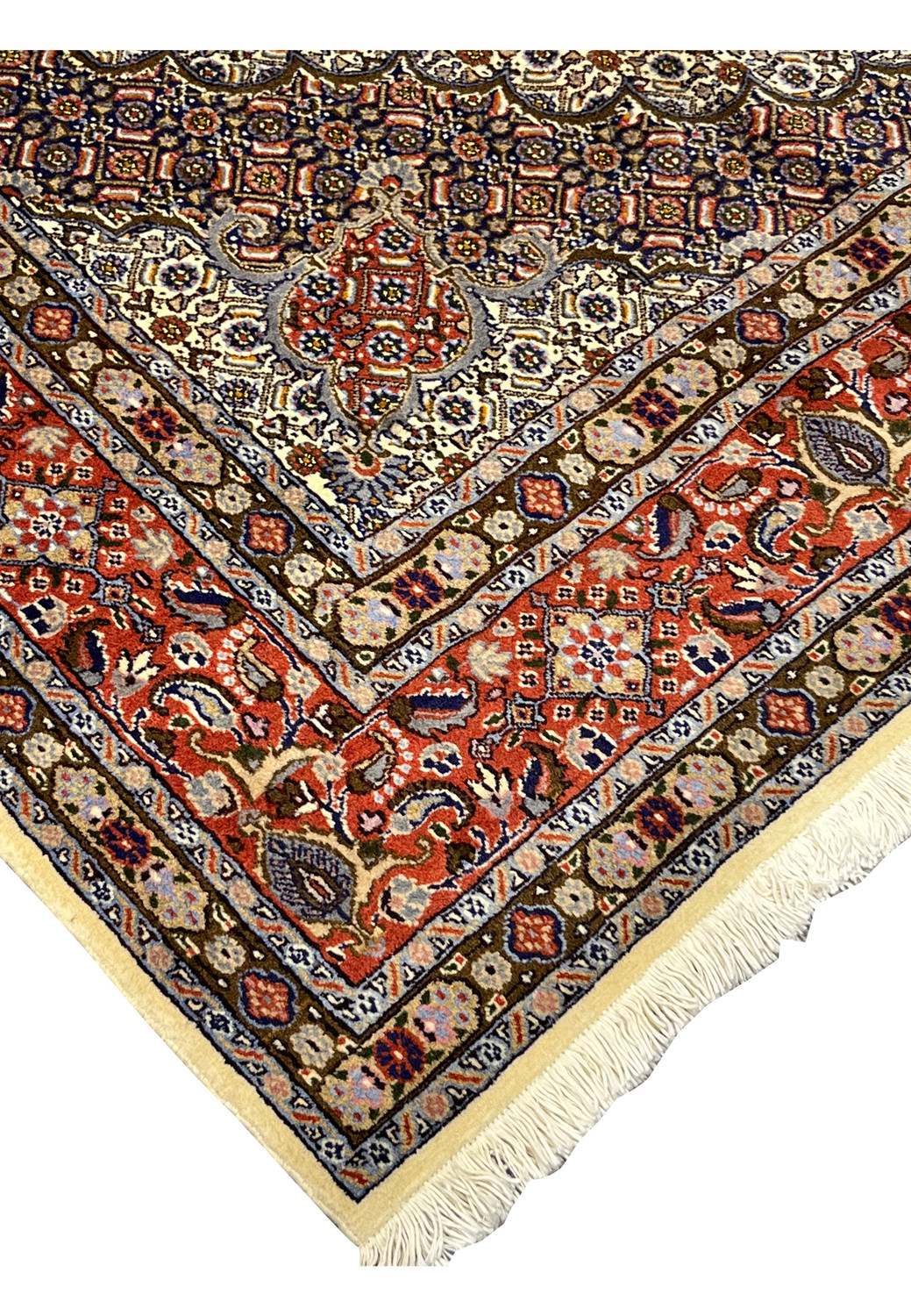 Detailed view of the Persian Moud Rug’s corner and fringe, showcasing the fine finishing, even knot tension, and warm interplay of ivory, red, and navy tones.