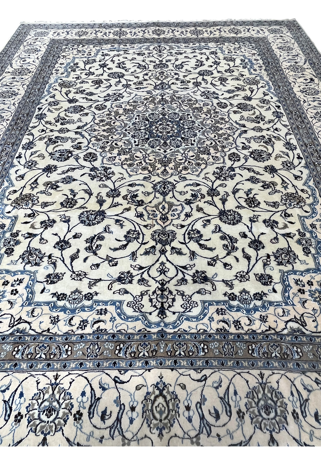 Front angled view of 10' x 13'2 Persian Nain 9LA Rug displaying balanced ivory field and blue floral composition.