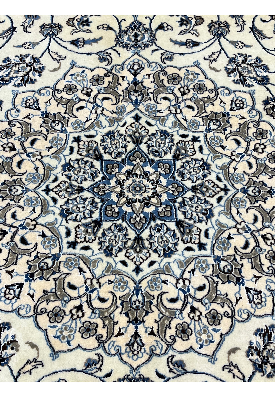 Close-up of 10' x 13'2 Persian Nain 9LA Rug medallion revealing fine silk outlines and detailed hand-knotted floral patterns.