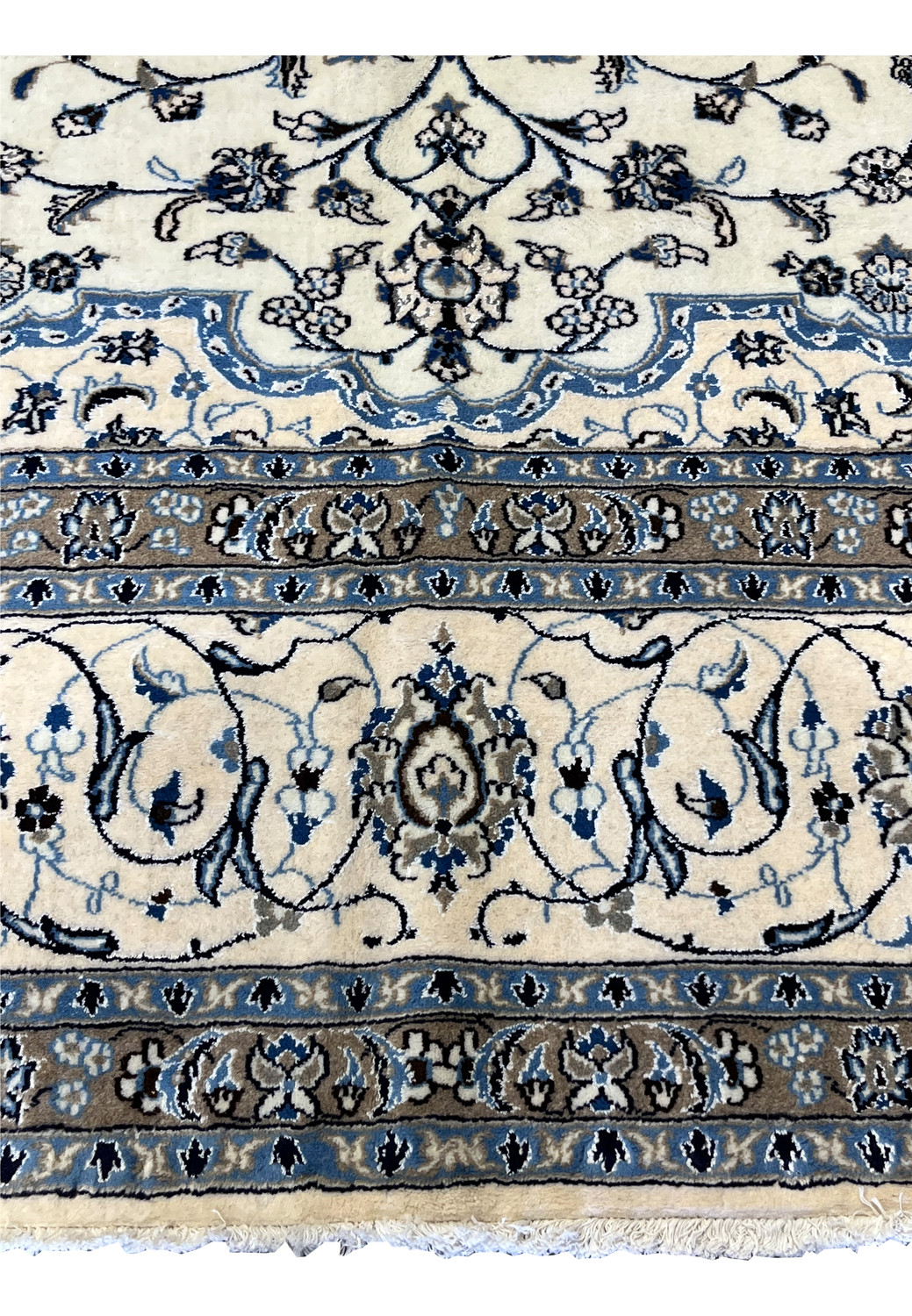 Ivory field and light-blue floral motifs with taupe borders of 10x13 Persian Nain 9LA Rug showing fine wool & silk weaving detail.