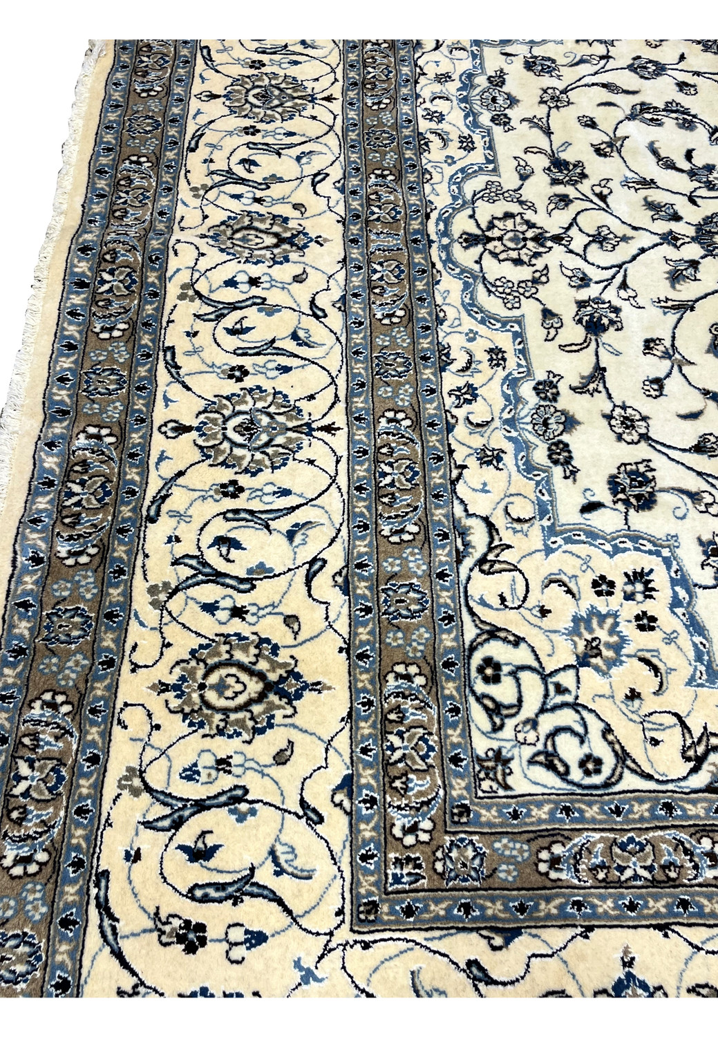 Beige and blue border section of 10x13 Persian Nain 9LA Rug featuring floral motifs outlined in navy and silk highlights.