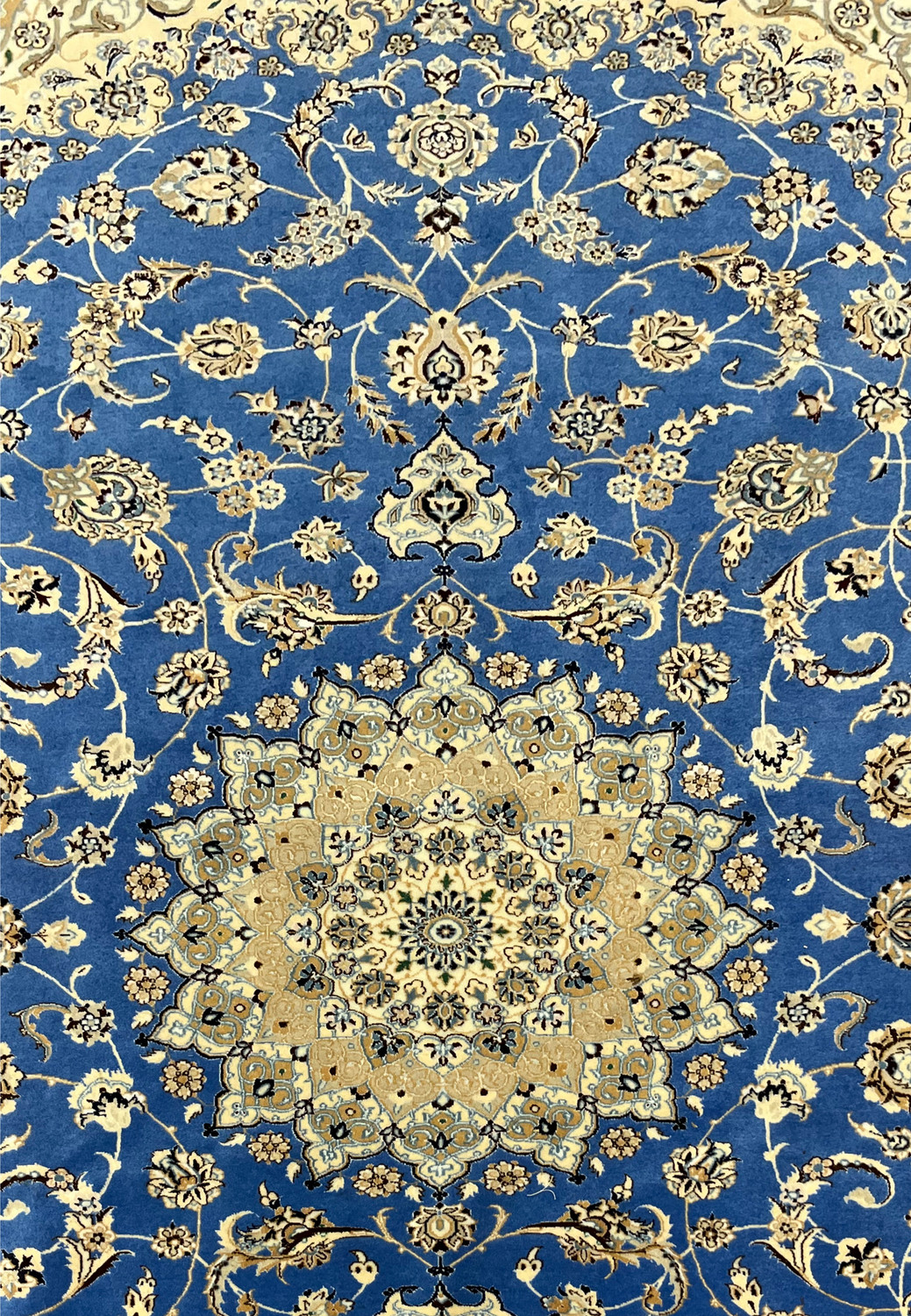 Central field and medallion of Persian Nain rug with royal blue background and ivory floral medallion