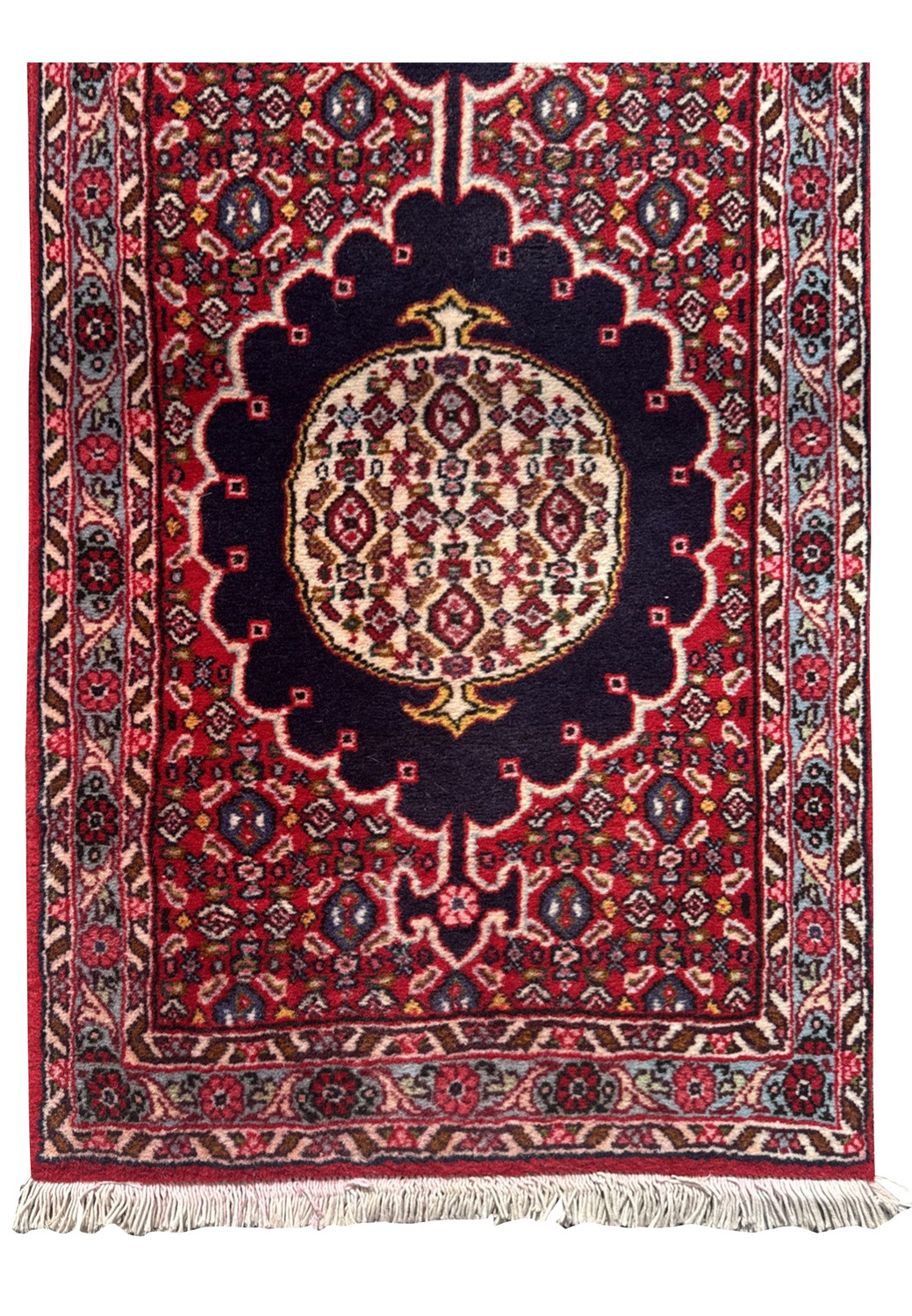 Central medallion with midnight-blue scallops, ivory lattice of red and sky-blue motifs, framed by deep crimson ground.