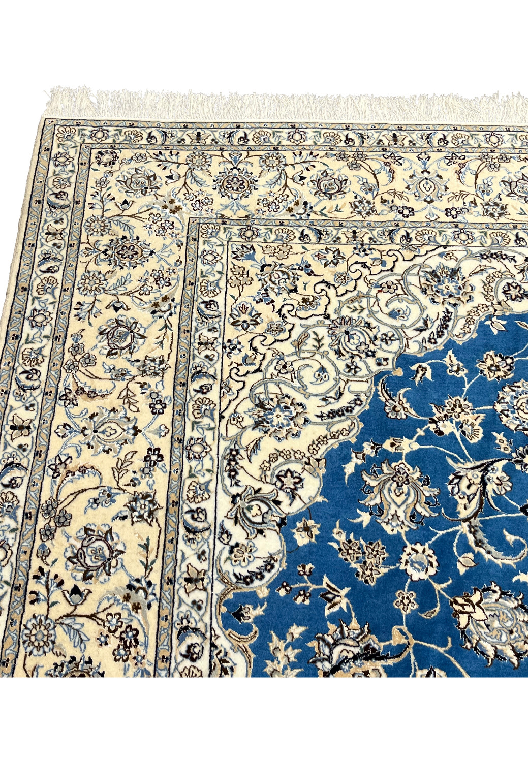 Ivory floral border with blue detailing of Persian Nain 6 LA rug showing fine hand-knotted weave.