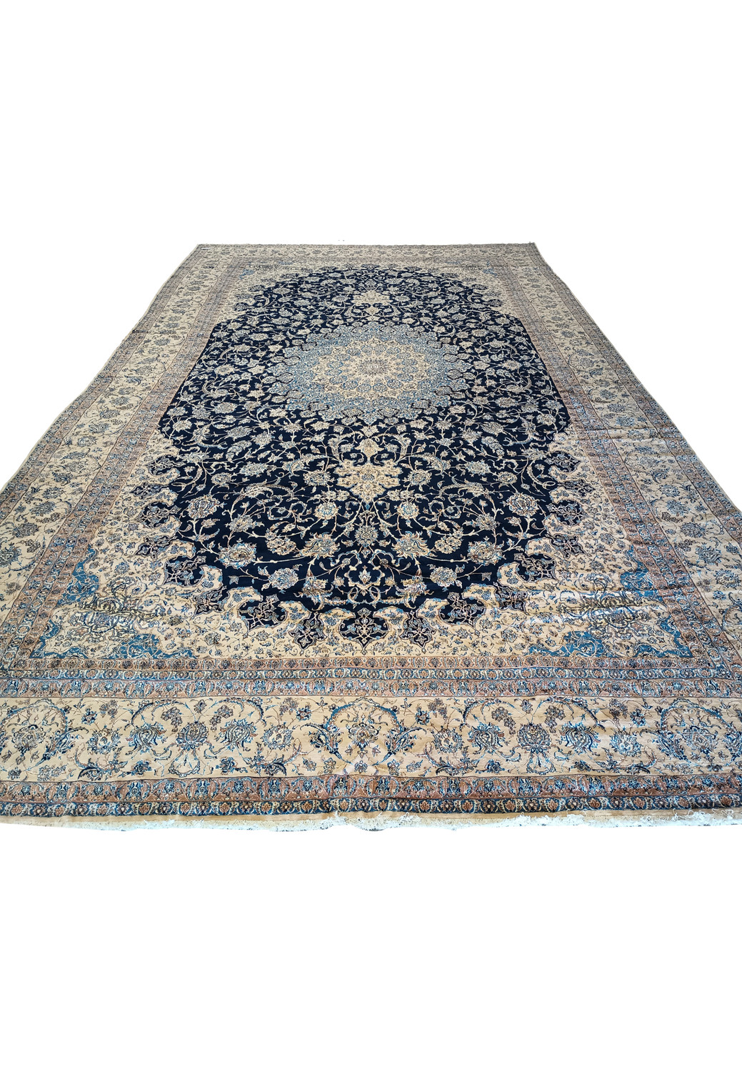 14x25'6 Nain 9 LA Persian rug laid flat with fold lines on navy and ivory floral pattern.