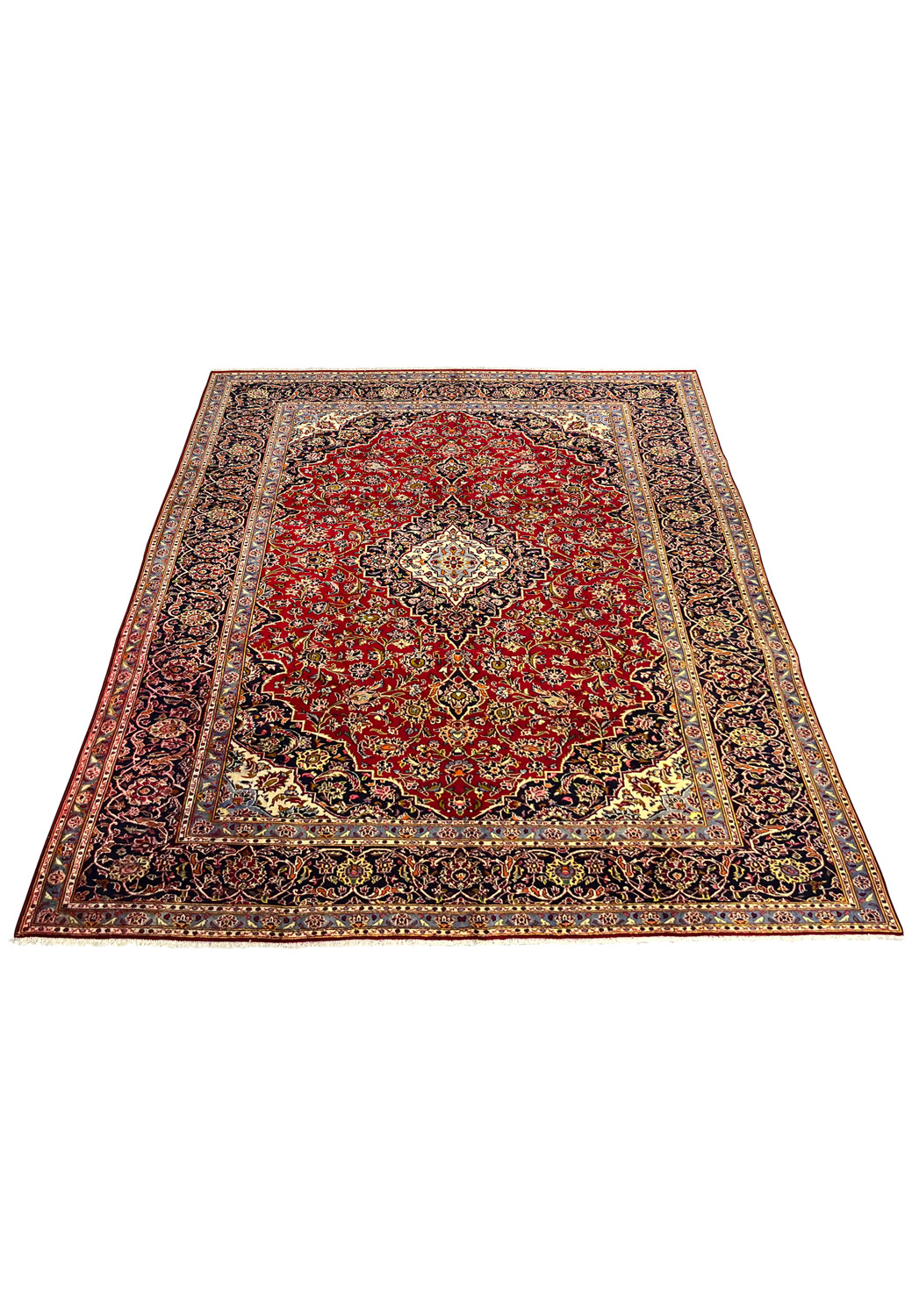 9x13 Persian Kashan rug laid flat with visible color variation