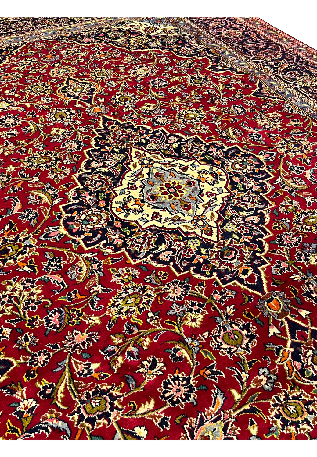 Midfield section of Persian Kashan rug 9x13 showing floral motifs and symmetry