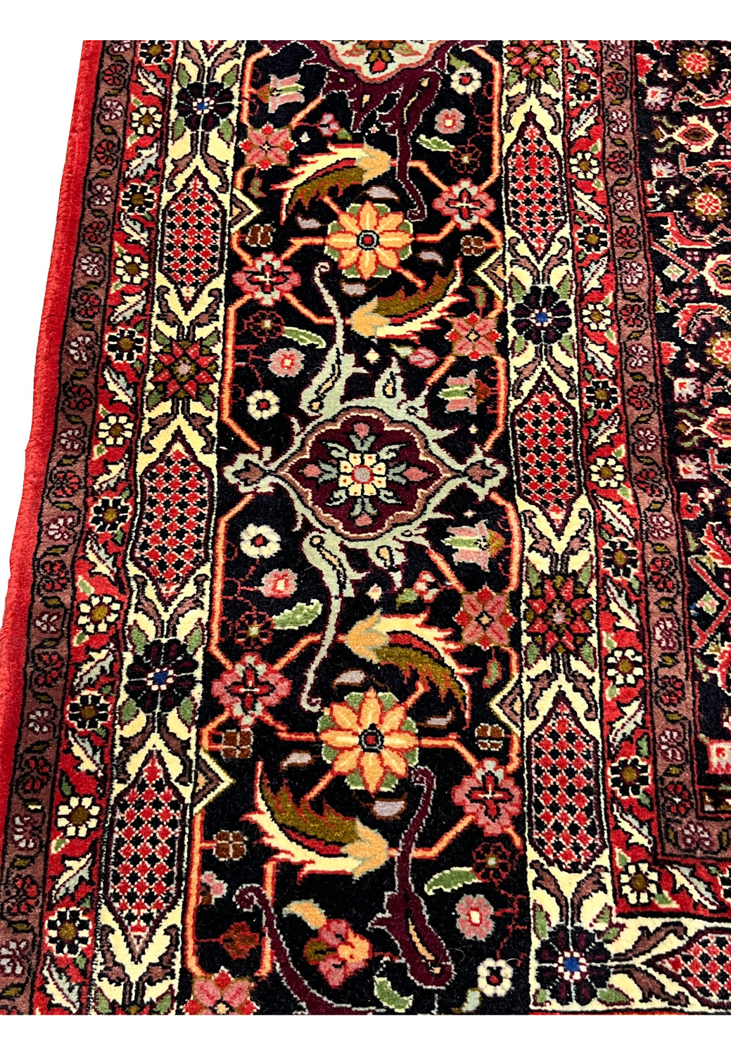 10x13 Bijar Persian Iron Rug field detail with bold red background and floral medallion geometry