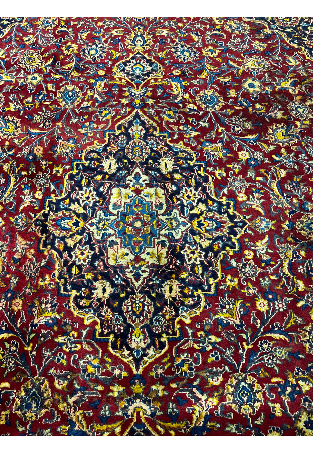 Close-up of the medallion showing patina texture and vintage knotting.