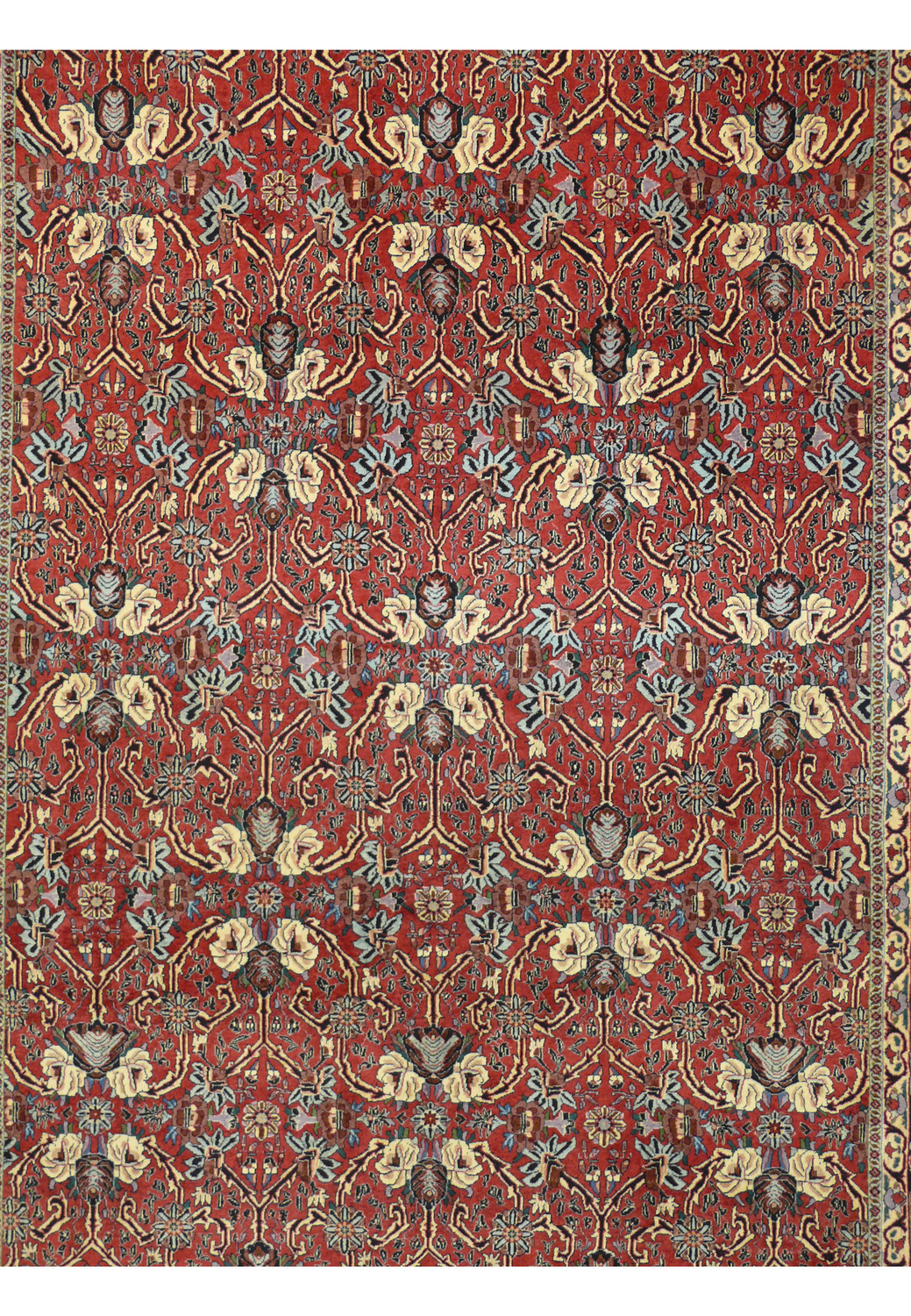 Close up floral motif on Bijar iron rug featuring ivory petals, navy contouring, sage green leaves, and antique gold accents