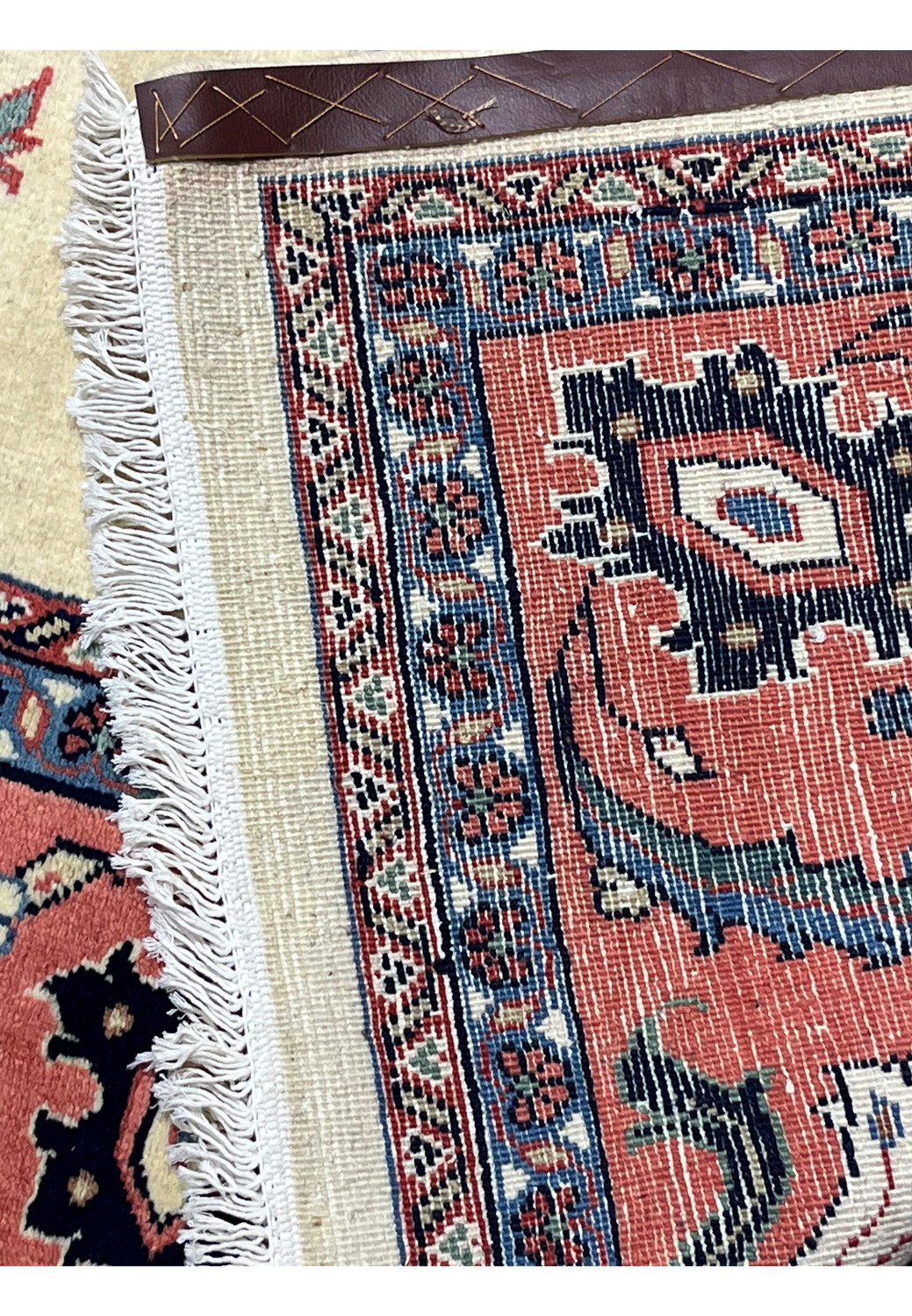 Backside of a hand knotted Persian Farahan rug showing knot structure, cotton foundation, and pattern clarity