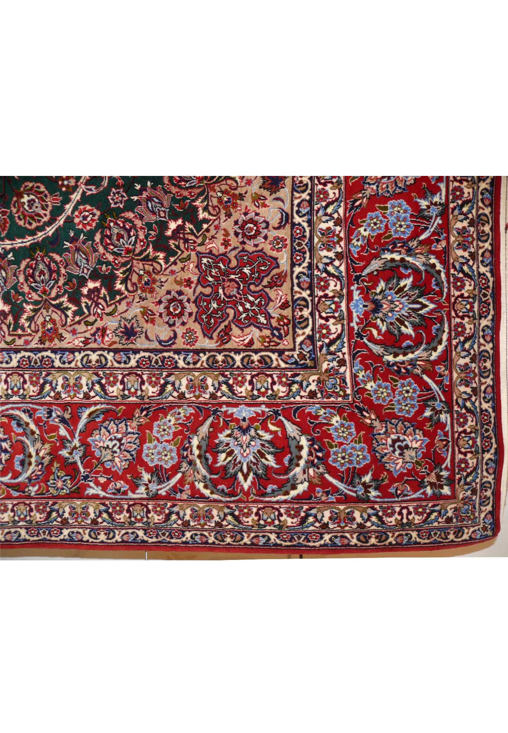 Close-up of edge and corner of Persian Isfahan rug showing precise hand-knotted finish and border details