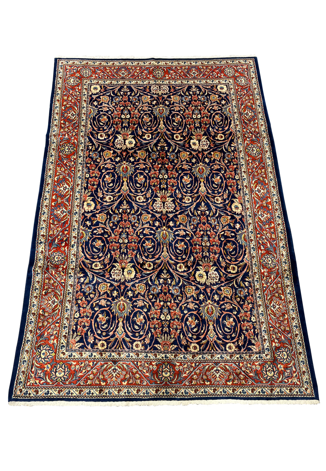Top view of Persian Sarough rug showing navy blue field and balanced floral motifs