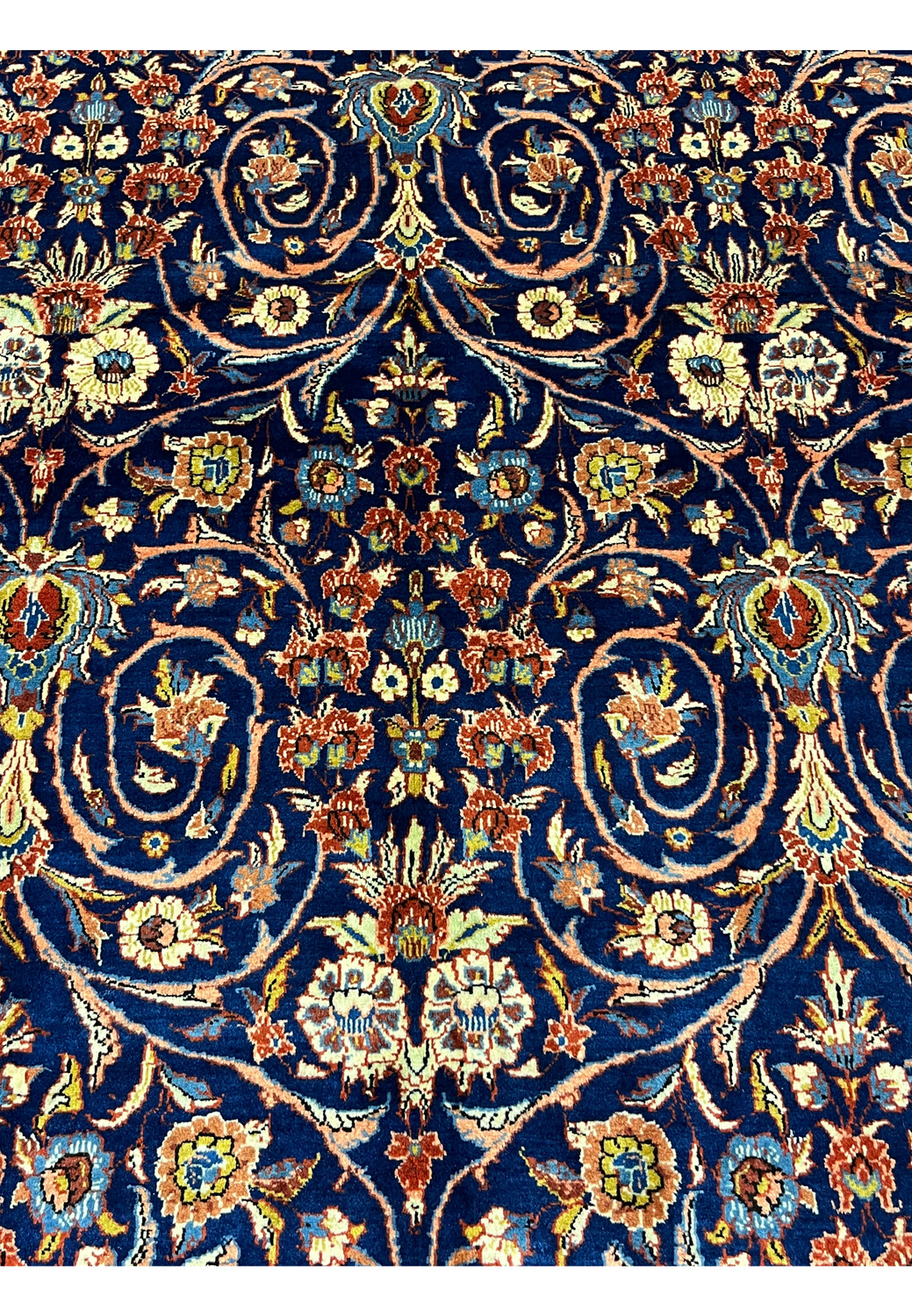 Detailed floral motif on Persian Sarough rug showing intricate blossoms and fine wool knotting