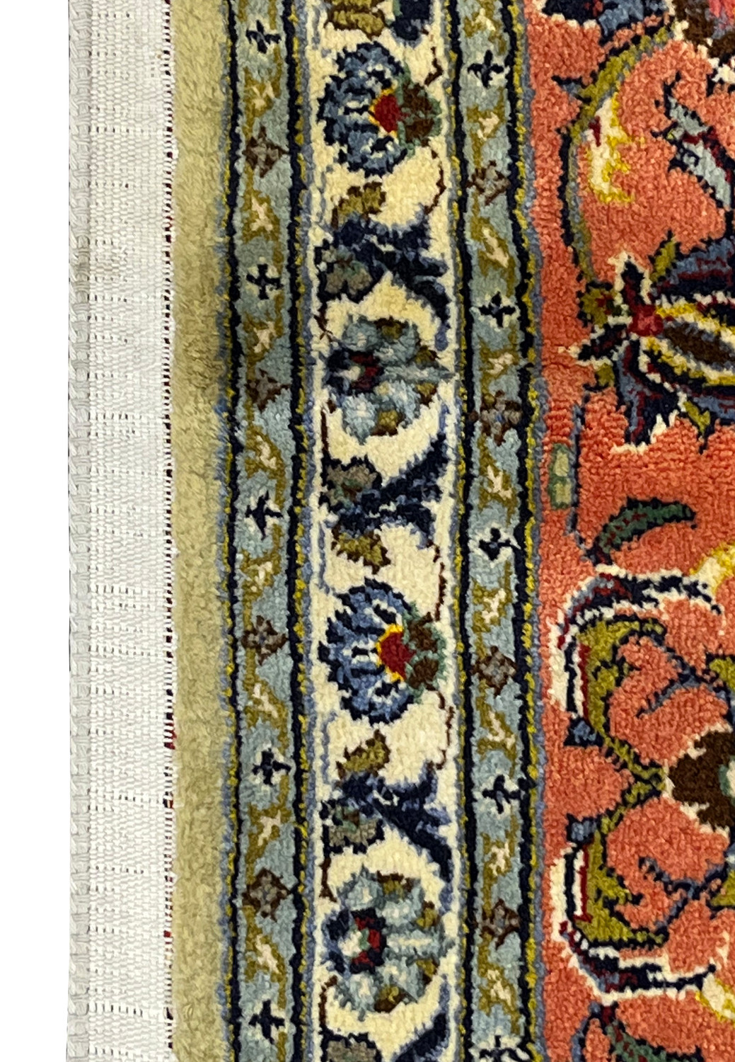 Fringe and corner detail of green Persian Kashan rug showing tidy hand-finished ends