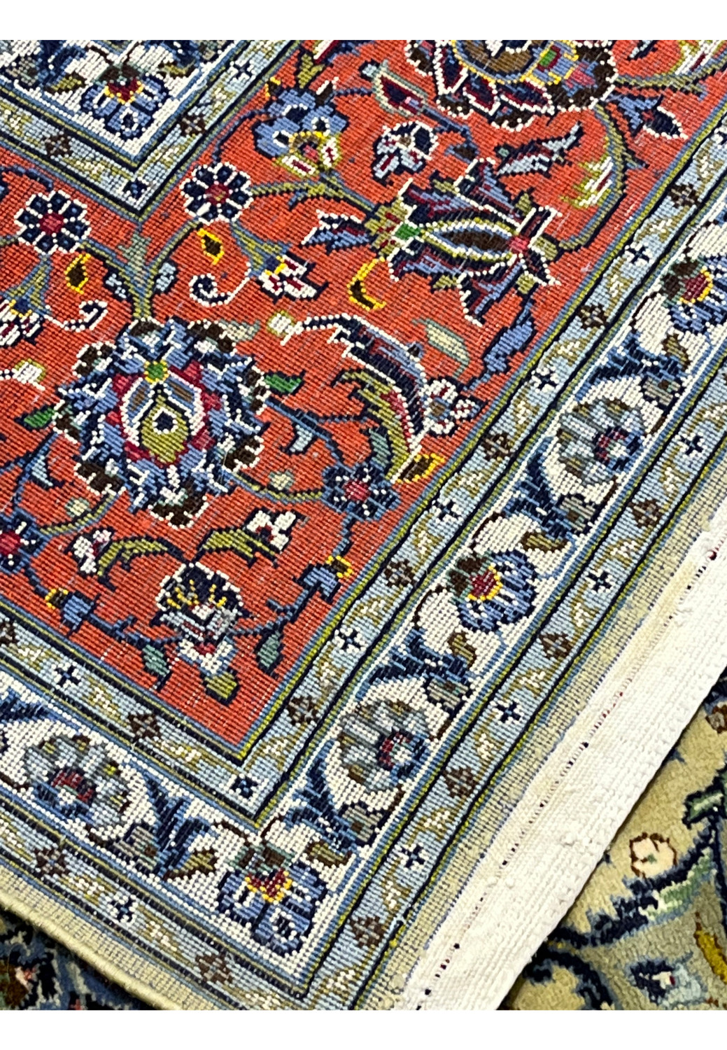 Reverse view of Persian Kashan rug revealing tight knot structure and precise weaving