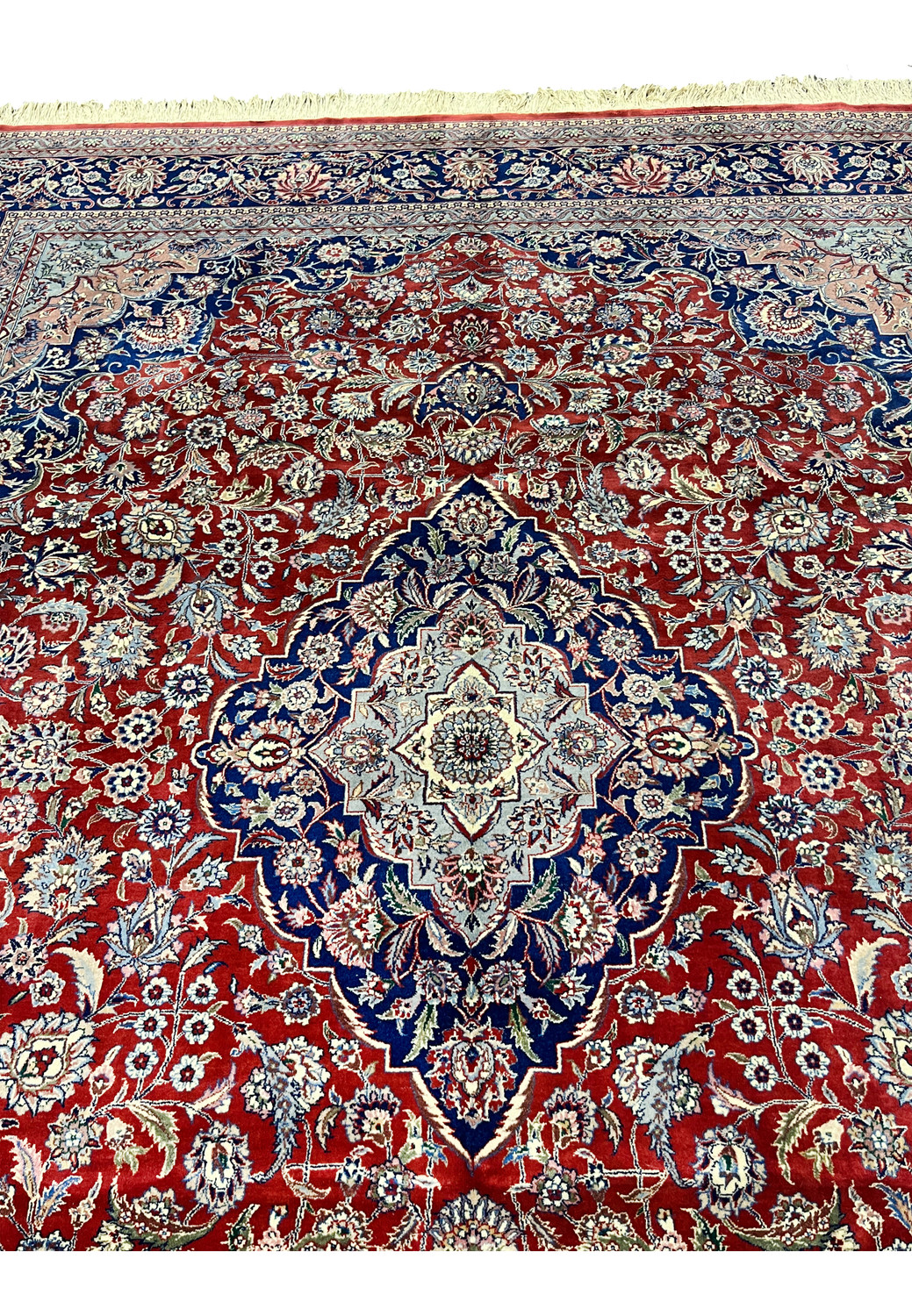 Upper field detail of Persian Kashan rug with dense floral vine pattern