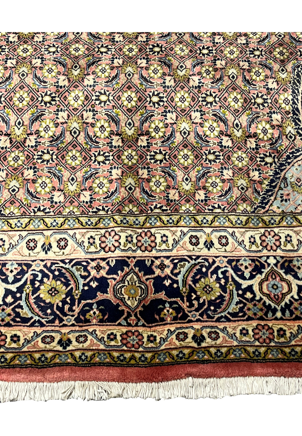 Lower border detail of Persian Bijar iron rug with navy ground and repeating floral motifs